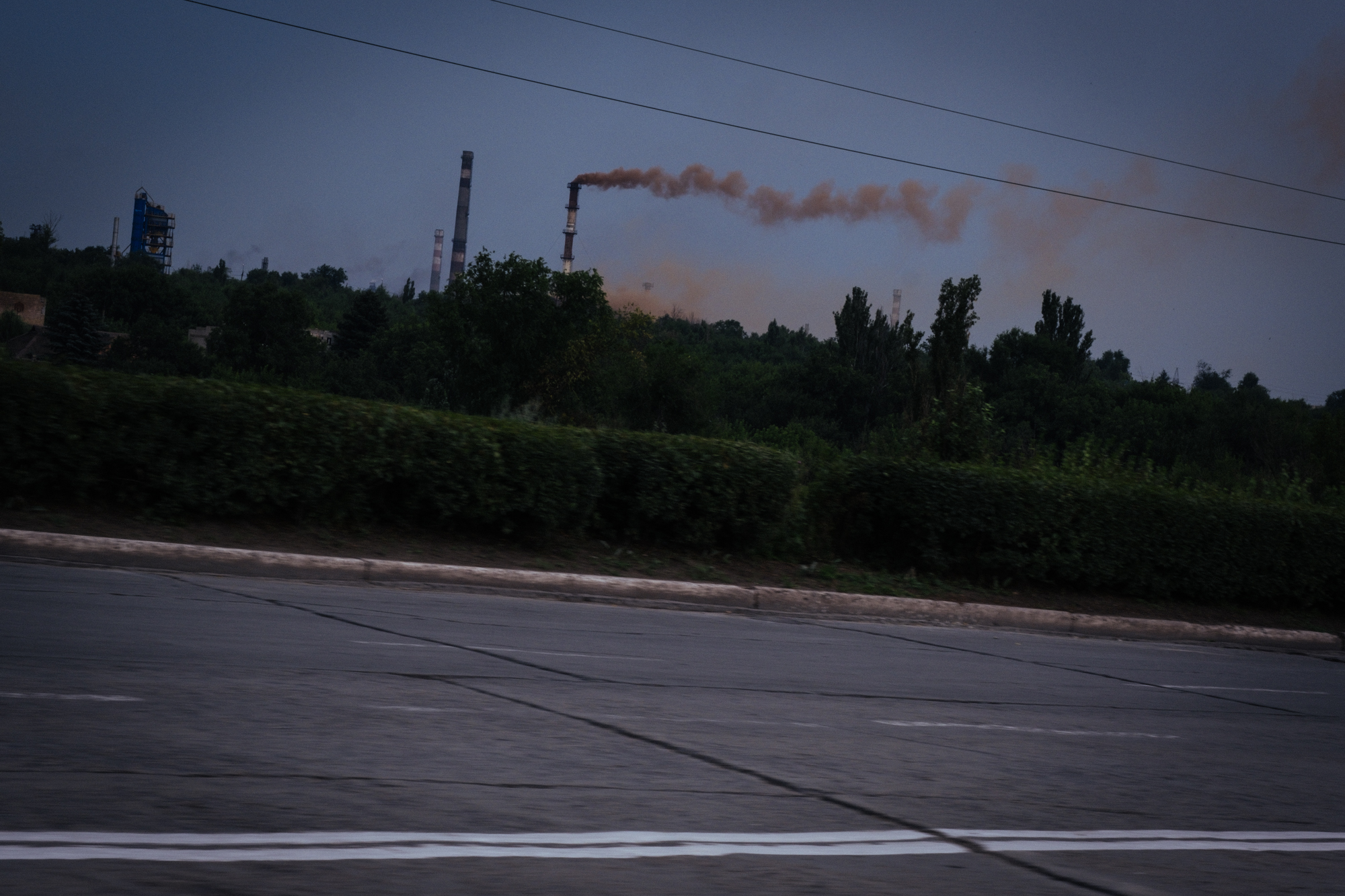 A photo of smoke coming out of a factory