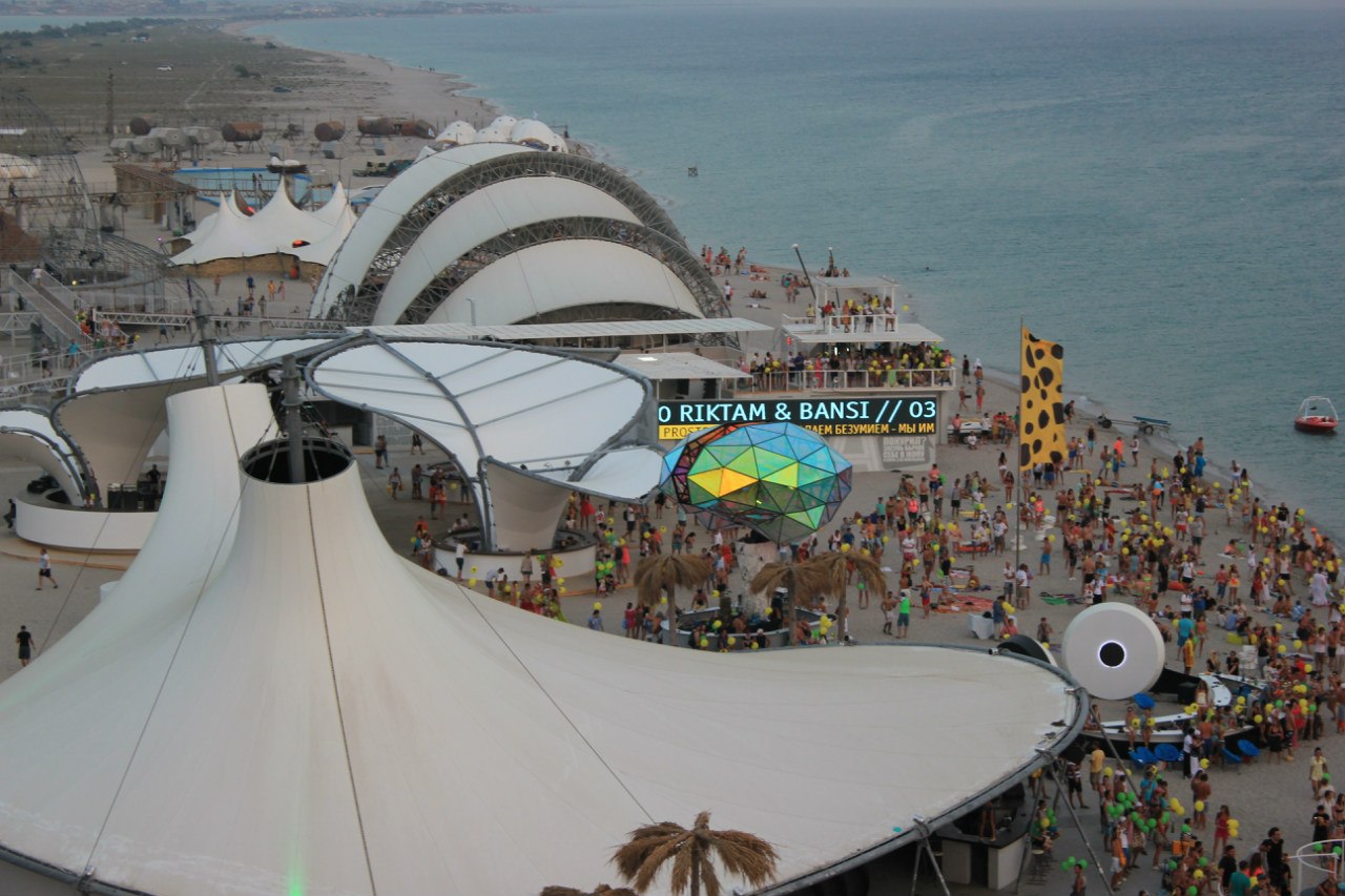 Dance-floor structures and revellers are seen at KaZantip. For one former festivalgoer, KaZantip happened at the right time – on the ‘ruins of the Soviet empire’ – and towards the end was already losing its allure [Courtesy of Nastya Ulyanova]