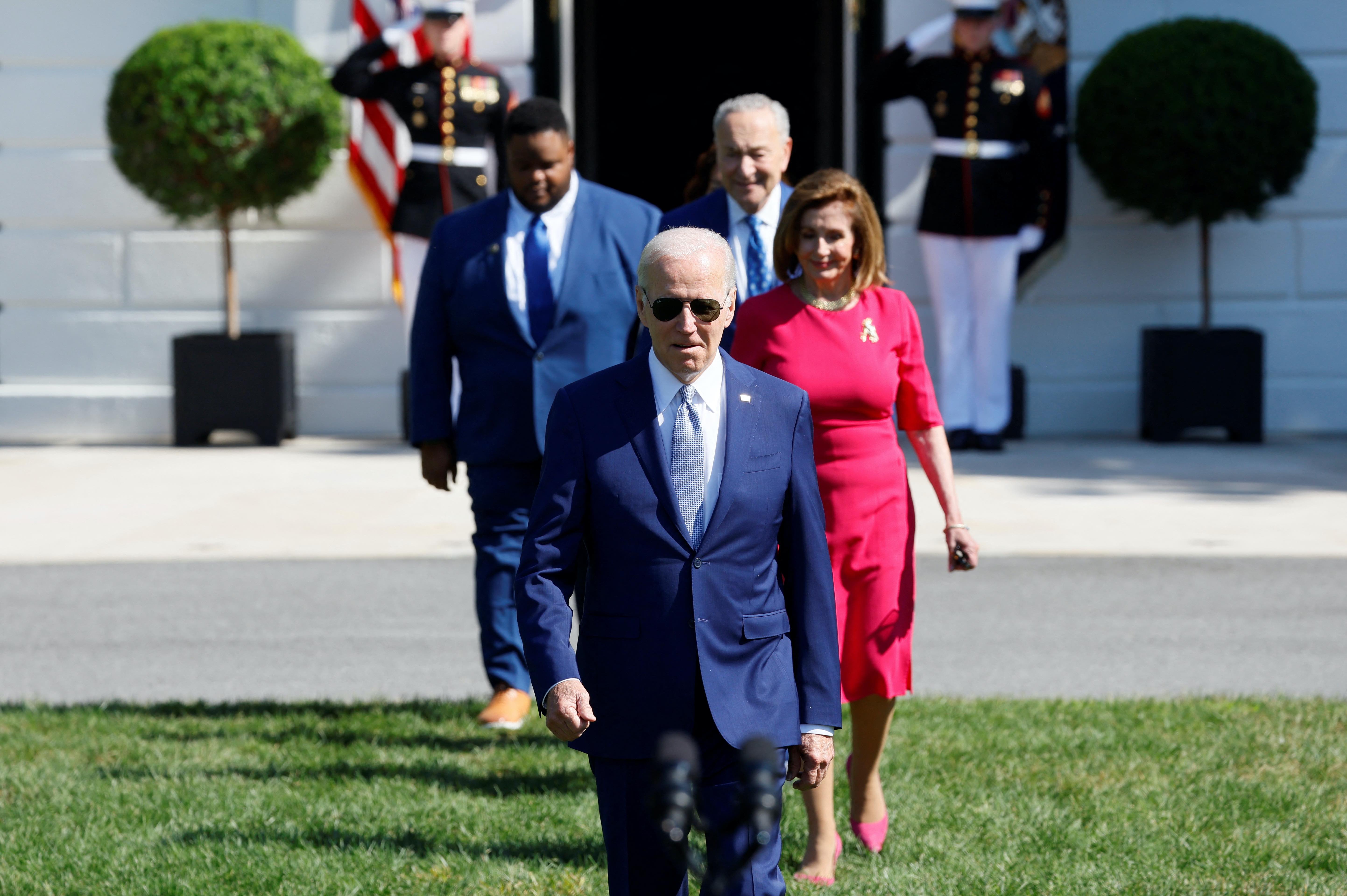 U.S. President Joe Biden walks to deliver remarks and sign the CHIPS and Science Act of 2022, on the South Lawn of the White House in Washington, U.S.