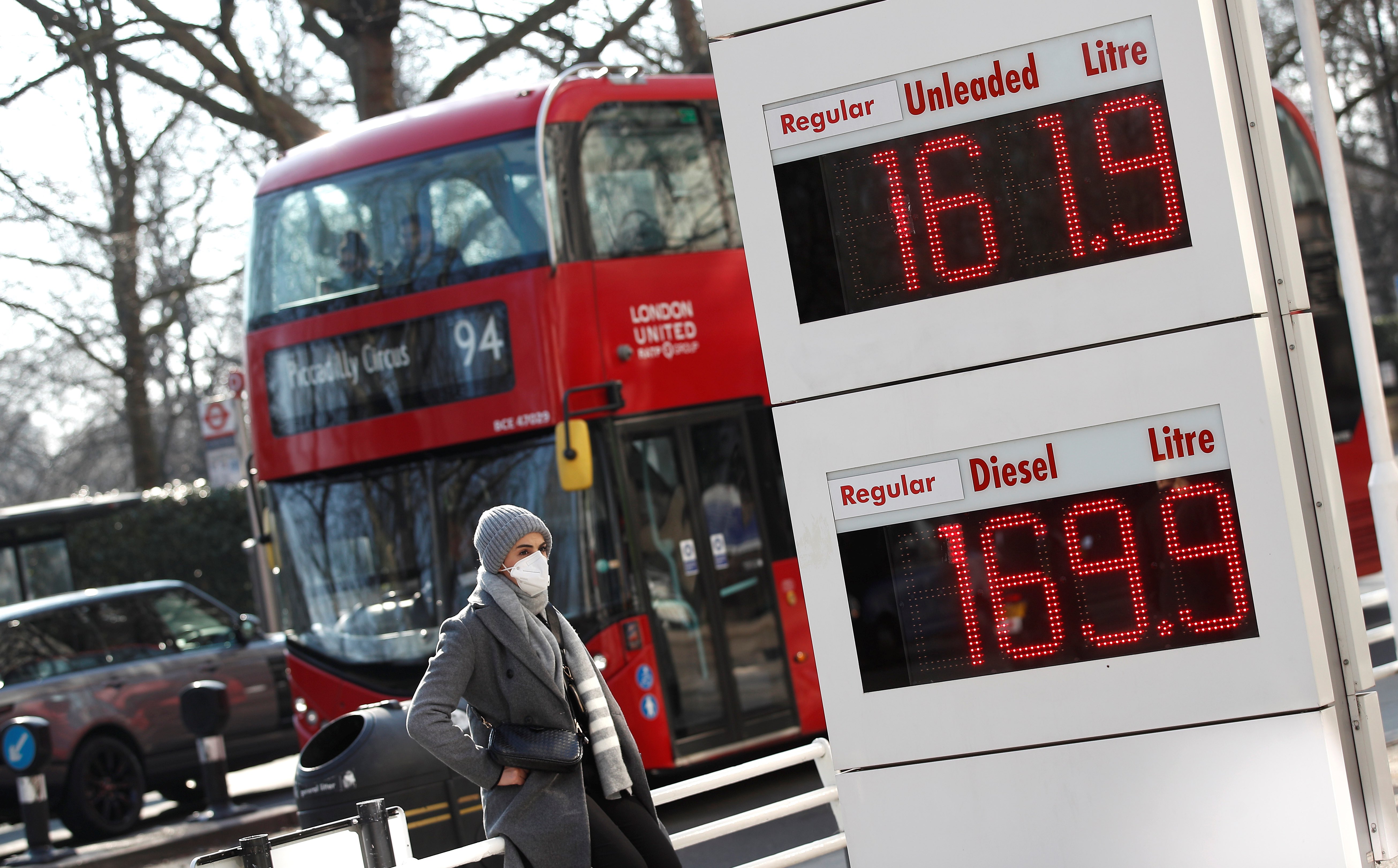 Increased petrol and diesel prices are seen on a display board at a filling station, in London, United Kingdom