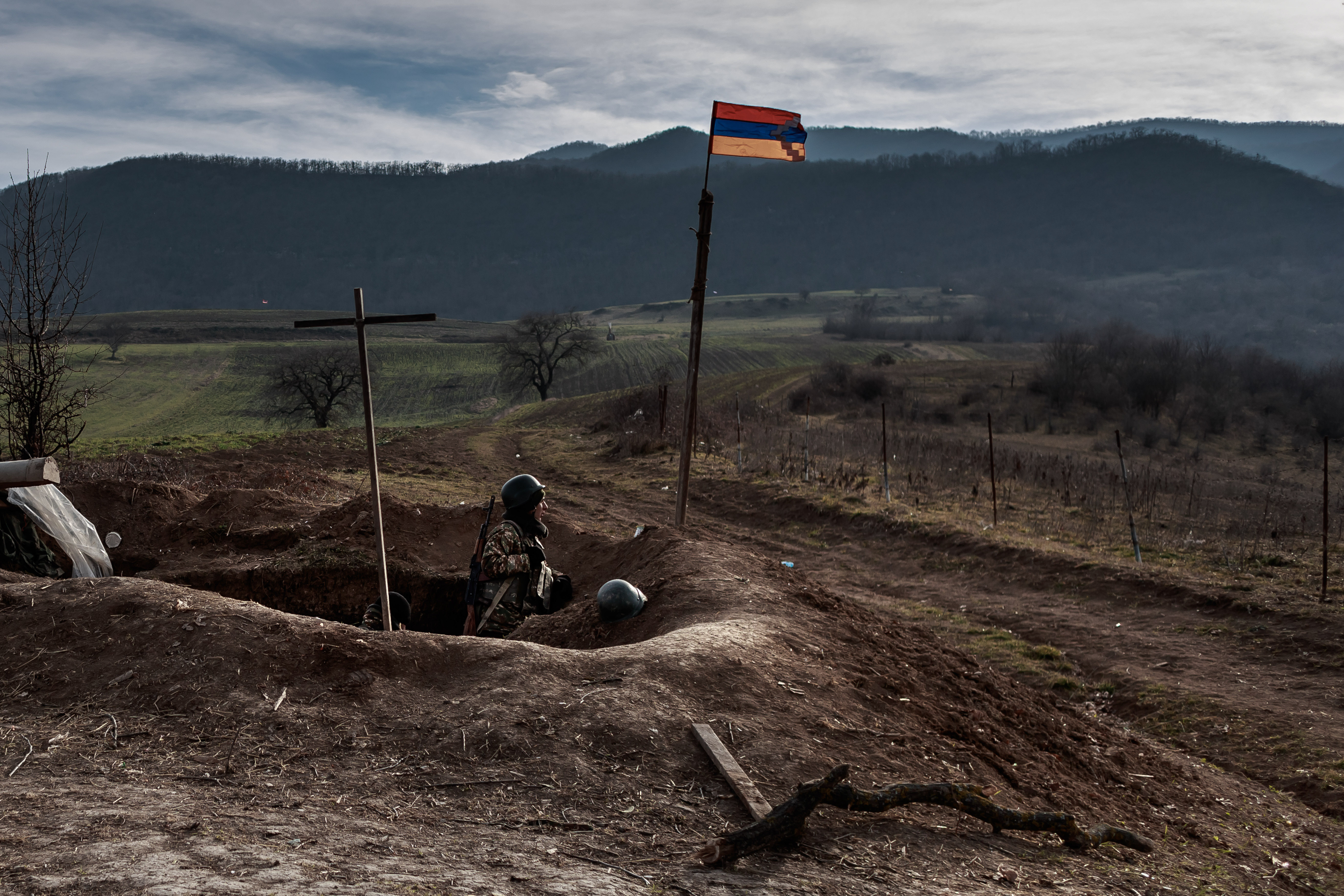 Armenian soldiers stand guard on a front position near Martuni