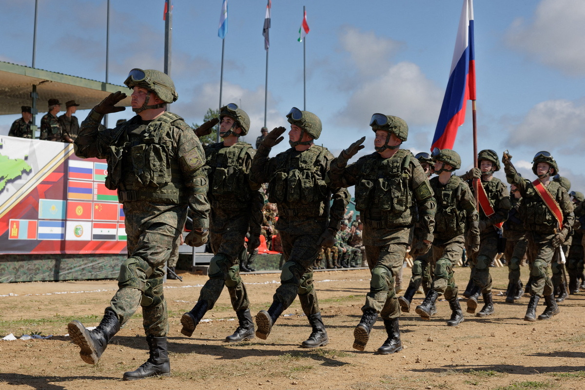 Russian service members take part in a ceremony opening Vostok 2022 military exercises at a firing ground in the far eastern Primorsky region, Russia, August 31, 2022. Russian Defence Ministry/Handout via REUTERS ATTENTION EDITORS- THIS IMAGE HAS BEEN SUPPLIED BY A THIRD PARTY. NO RESALES. NO ARCHIVES. MANDATORY CREDIT