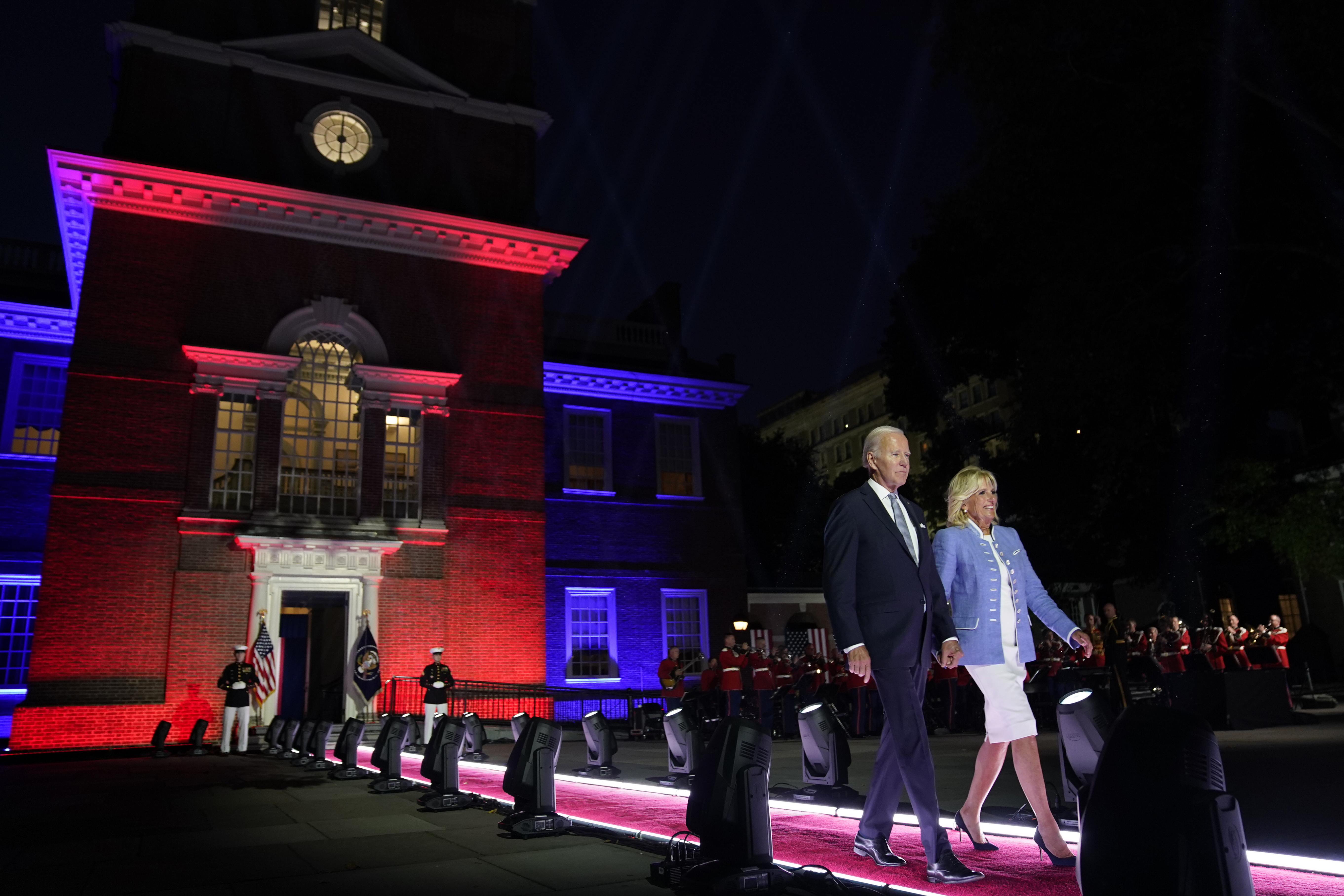 Joe and Jill Biden walk out along the stage at Philadelphia Hall