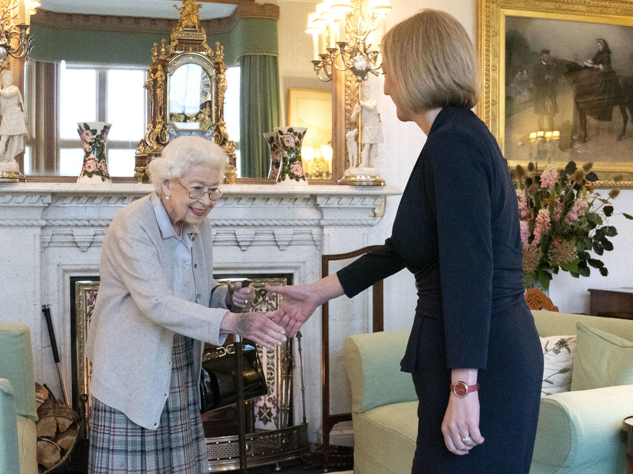 Britain's Queen Elizabeth II, left, welcomes Liz Truss during an audience at Balmoral, Scotland,