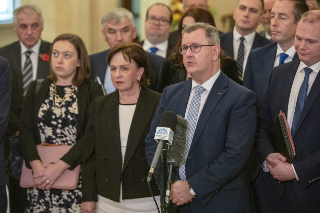Northern Ireland's Democratic Unionist Party (DUP) leader Jeffrey Donaldson (centre right) speaks surrounded by his Assembly team, in the great hall at Stormont Estate in Belfast