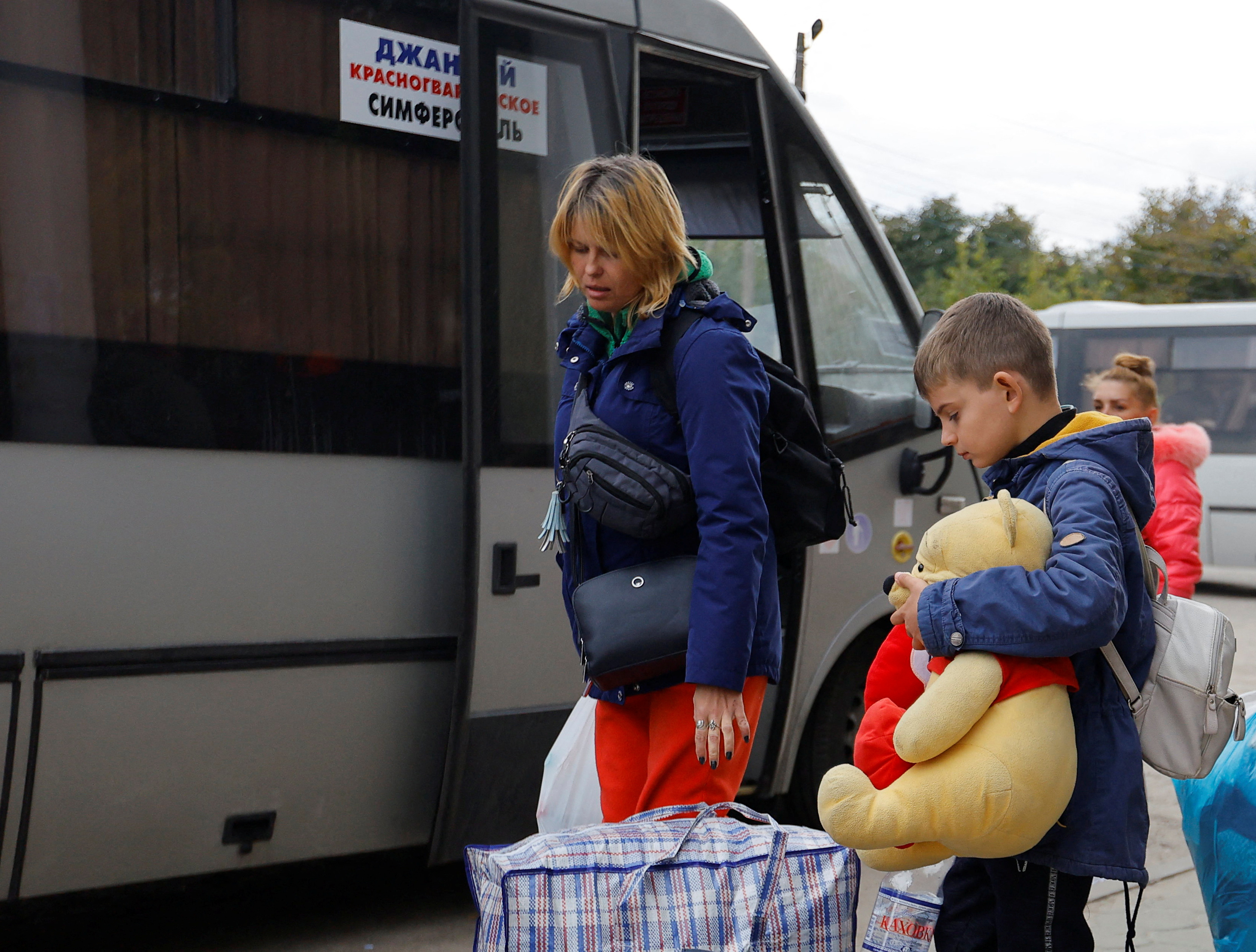 Civilians evacuated from the Russian-controlled city of Kherson