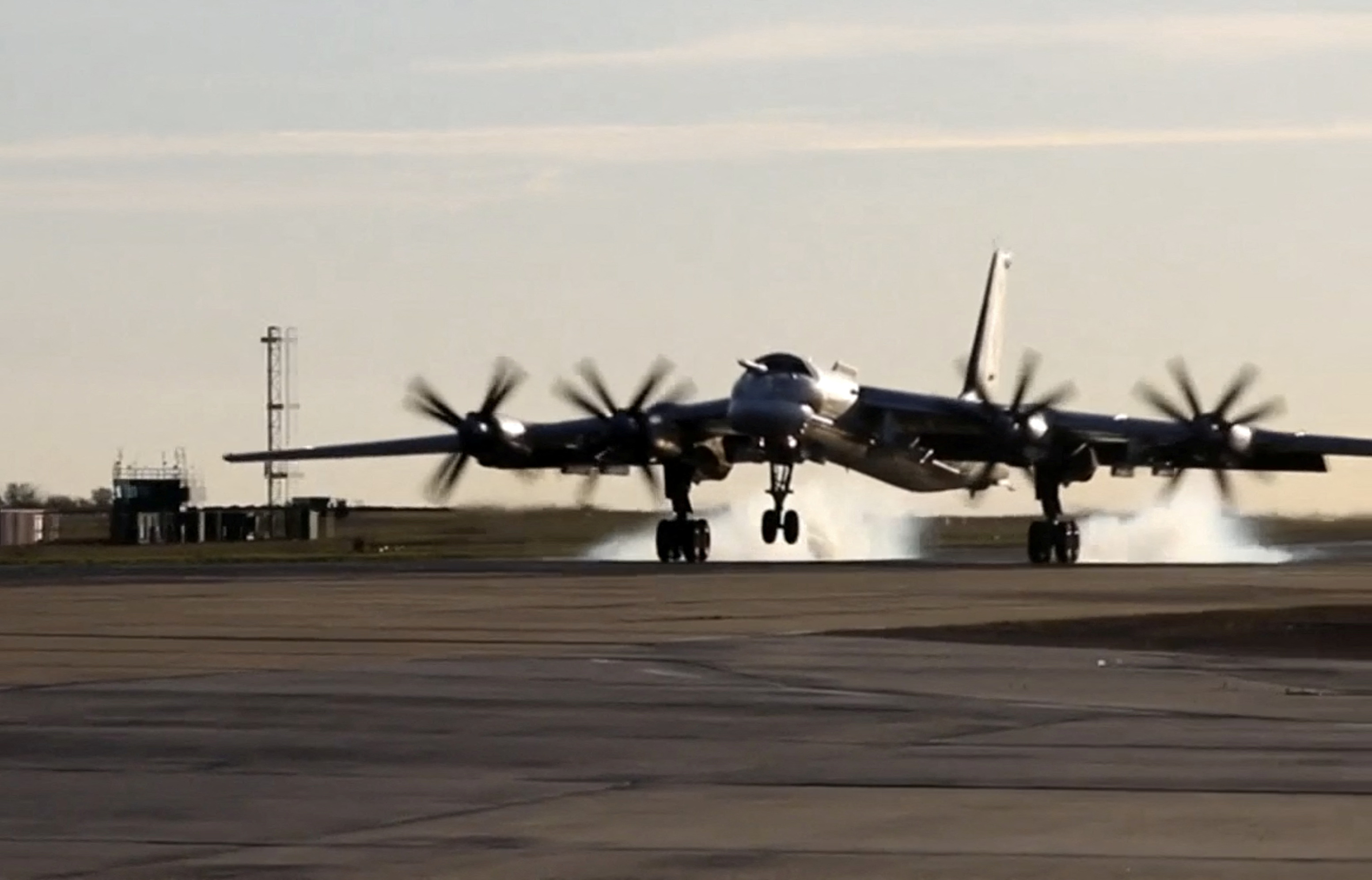 A still image from video, released by the Russian Defence Ministry, shows what it said to be Russia's Tu-95MS strategic bomber landing during exercises held by the country's strategic nuclear forces at an unknown location, in this image taken from handout footage released October 26, 2022.