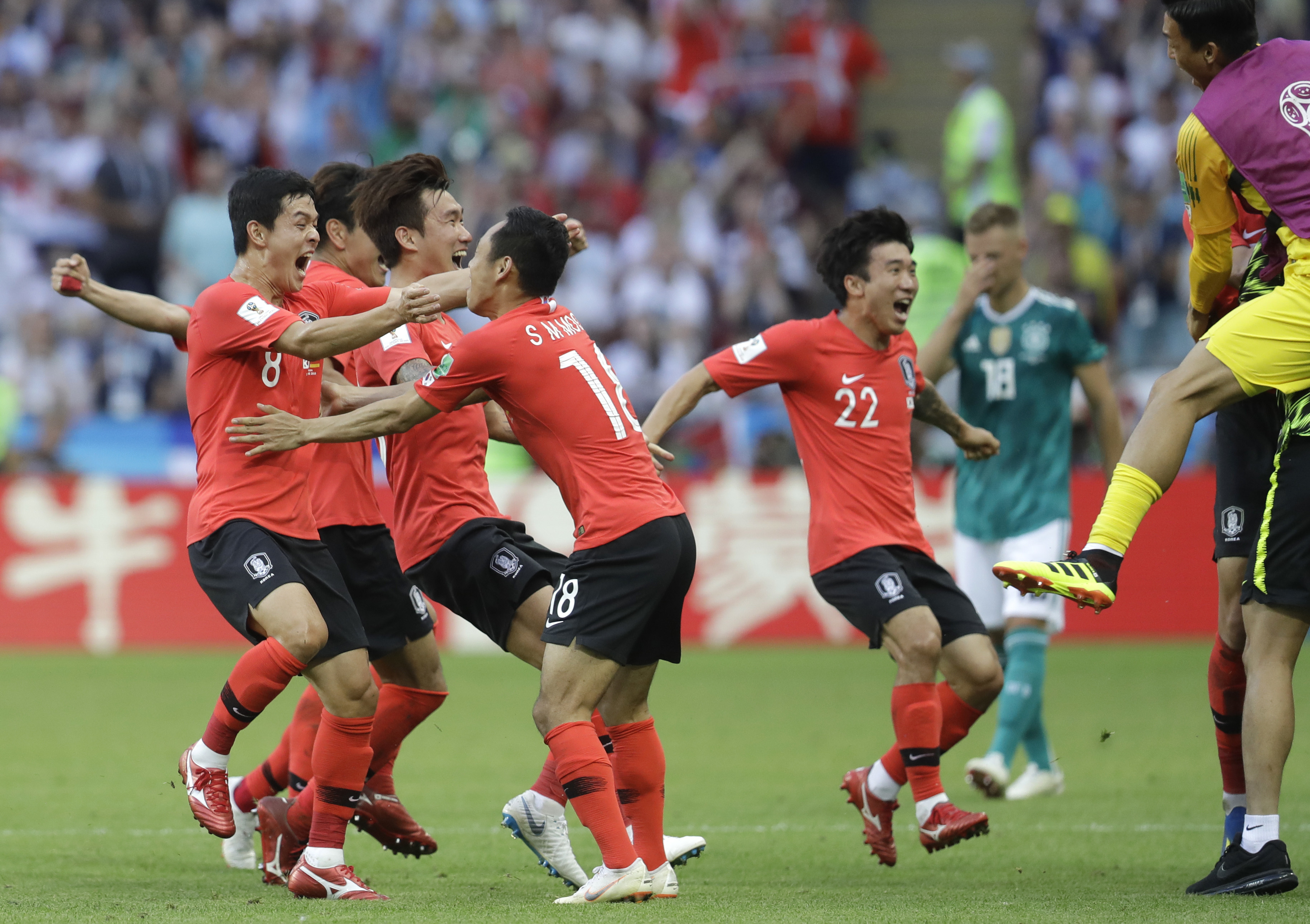 South Korean players celebrate after referee Mark Geiger from the US decided on goal