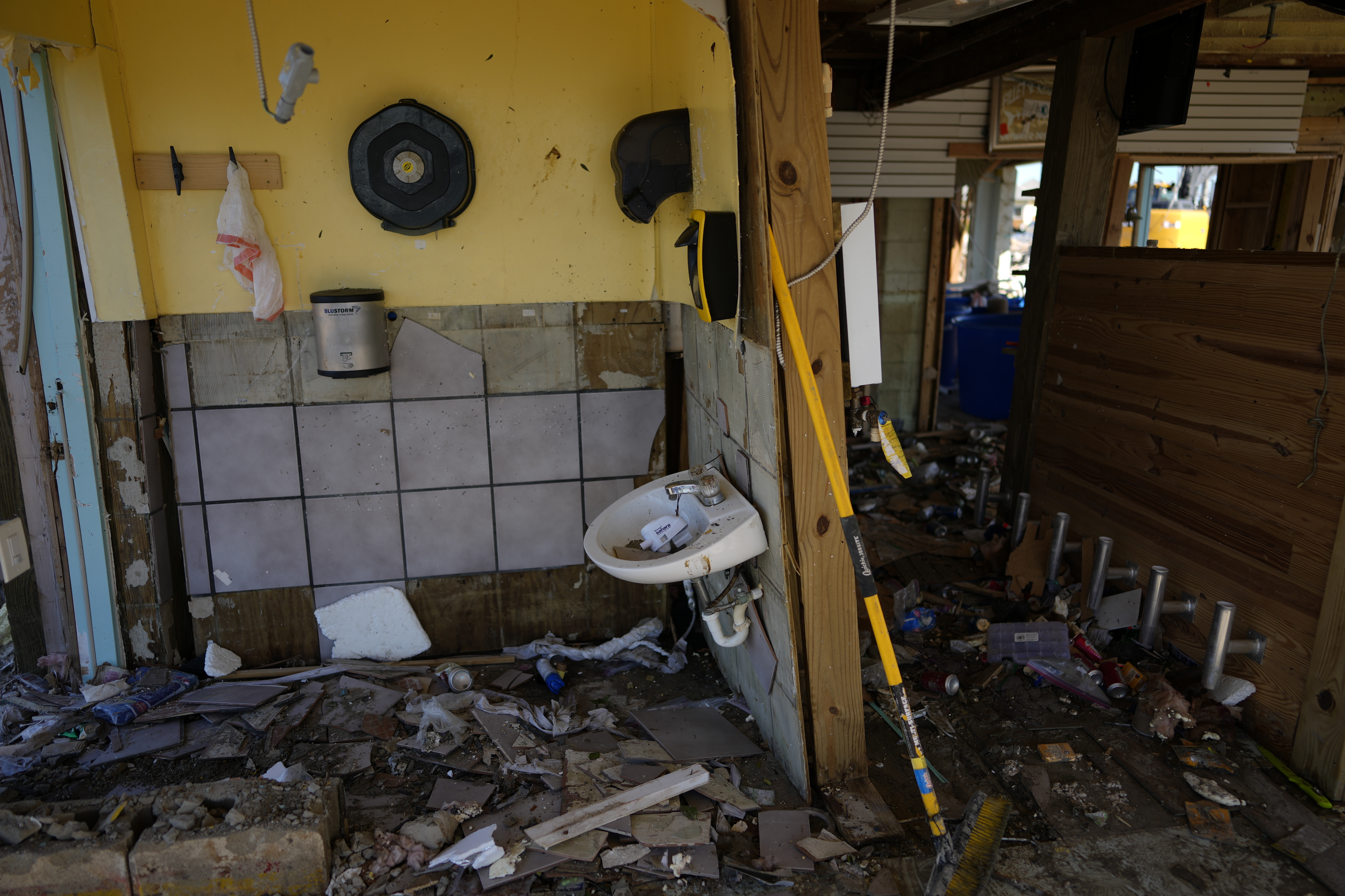 A bathroom lies exposed and missing fixtures at Getaway Marina, as owner Robert Leisure begins the long process of rebuilding his business after the passage of Hurricane Ian
