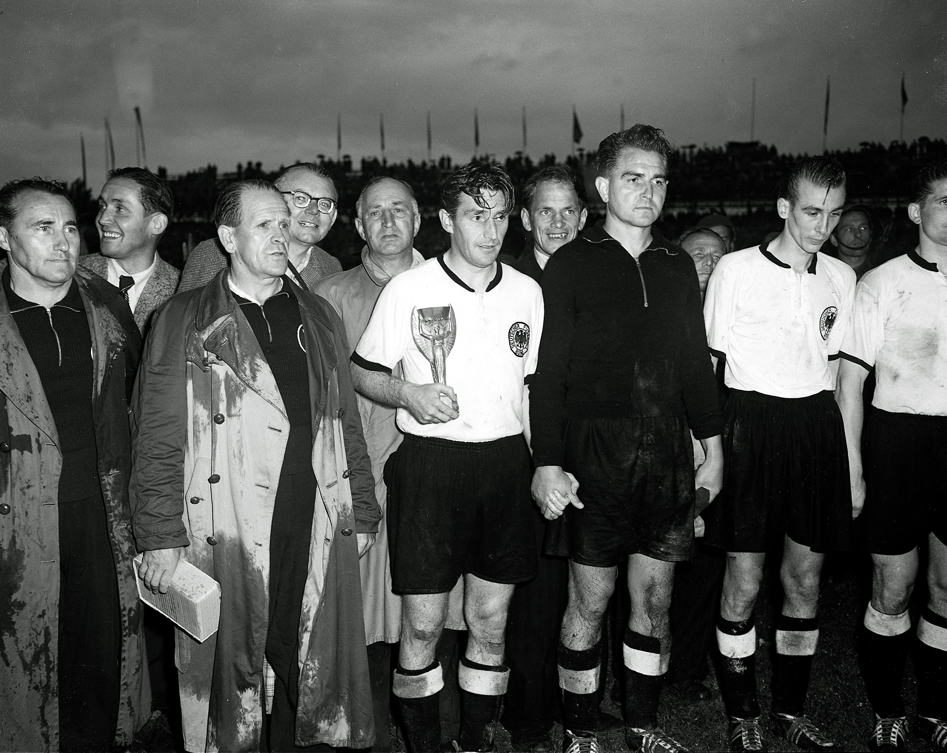 West Germany's captain Fritz Walter holds the Jules Rimet Gold Cup at Berne, Switzerland, July 4, 1954, after West Germany defeated tournament favourites Hungary 3-2 in the World Cup final