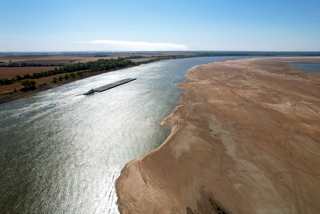 A barge makes its way down the Mississippi River