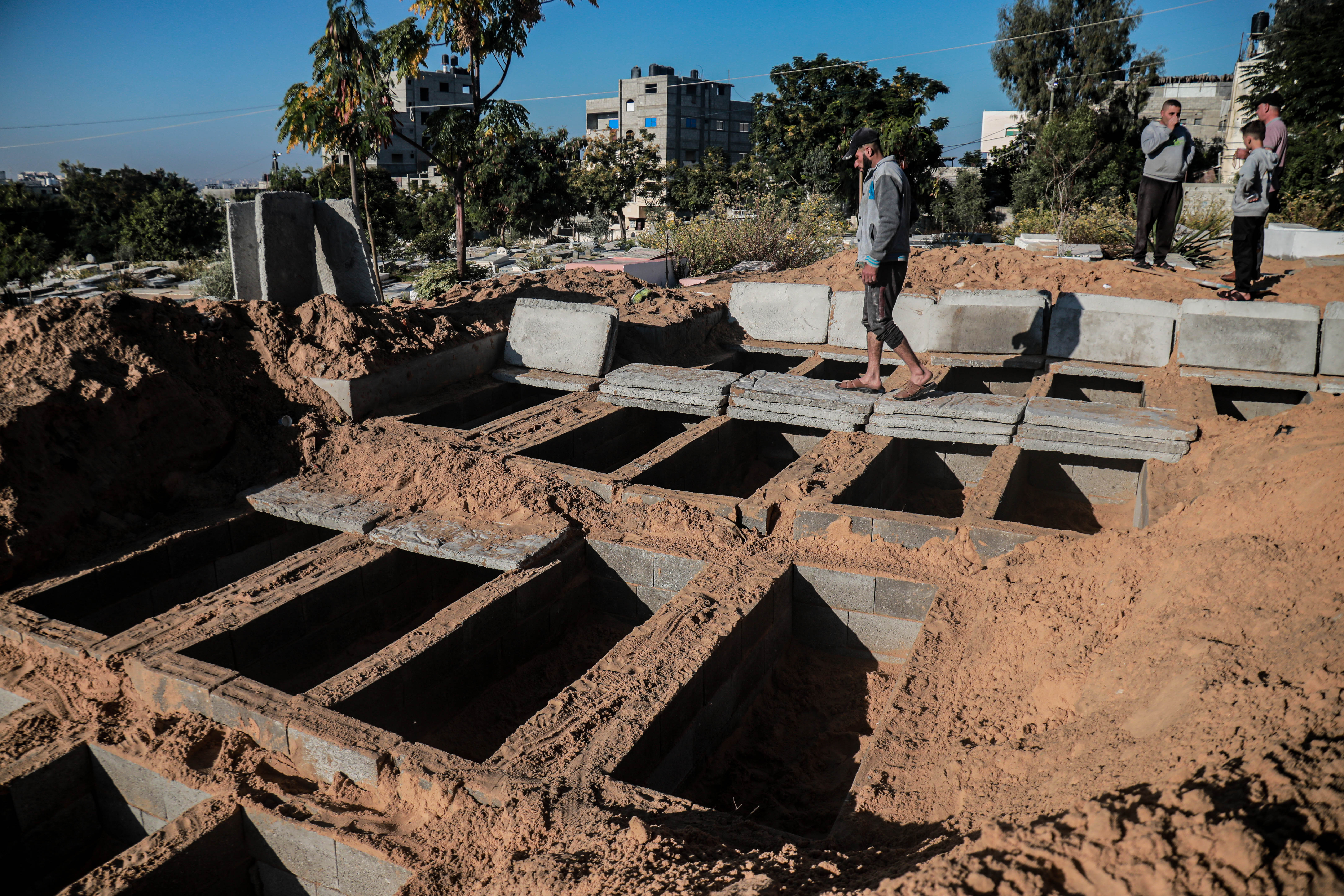 The burial places of the 21 family members in the Jabalia cemetery in the northern Gaza Strip