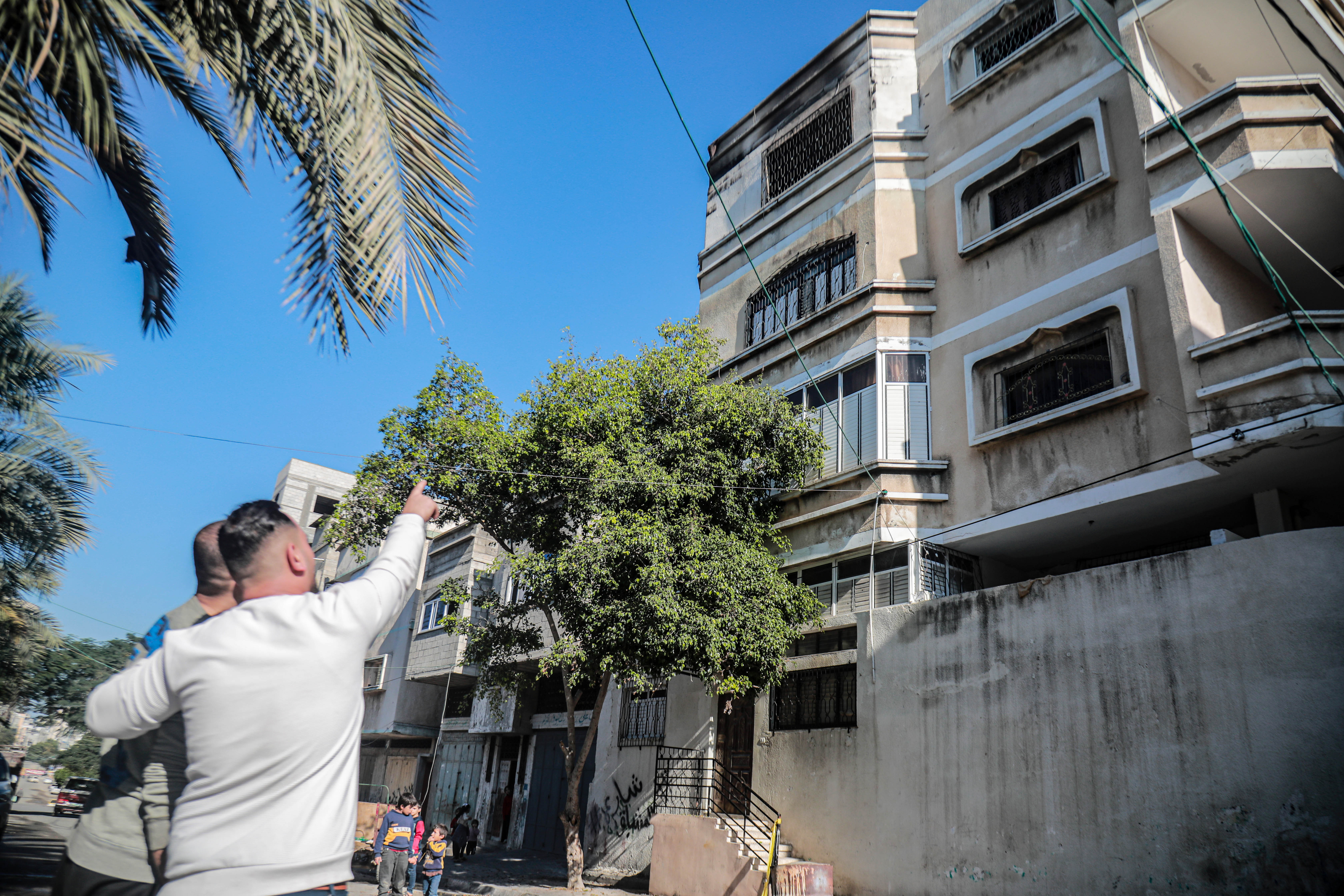 Neighbours gathered outside the building where the fire took place