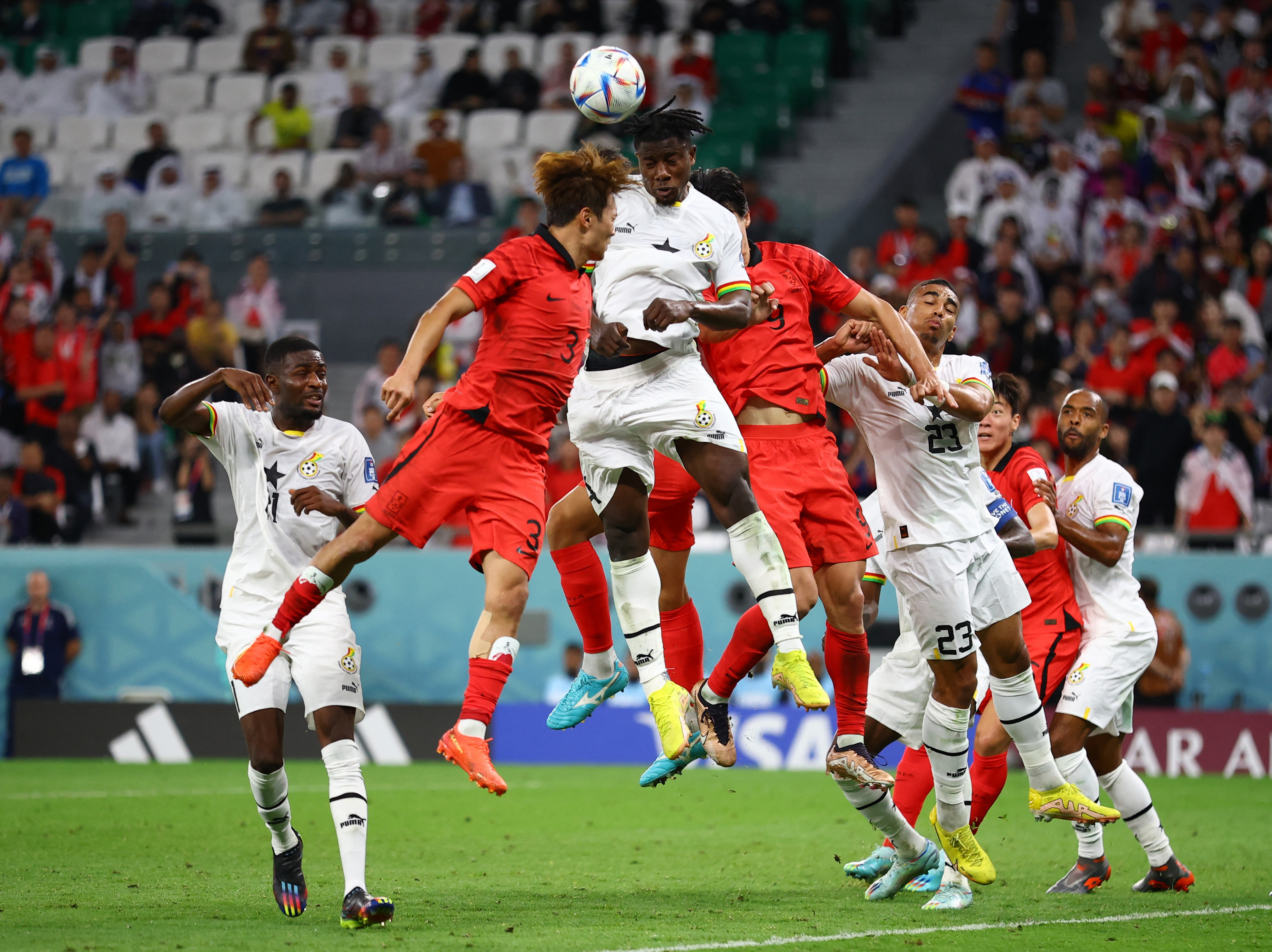 Ghana's Mohammed Salisu in action with South Korea's Kim Jin-su during their Group H game.