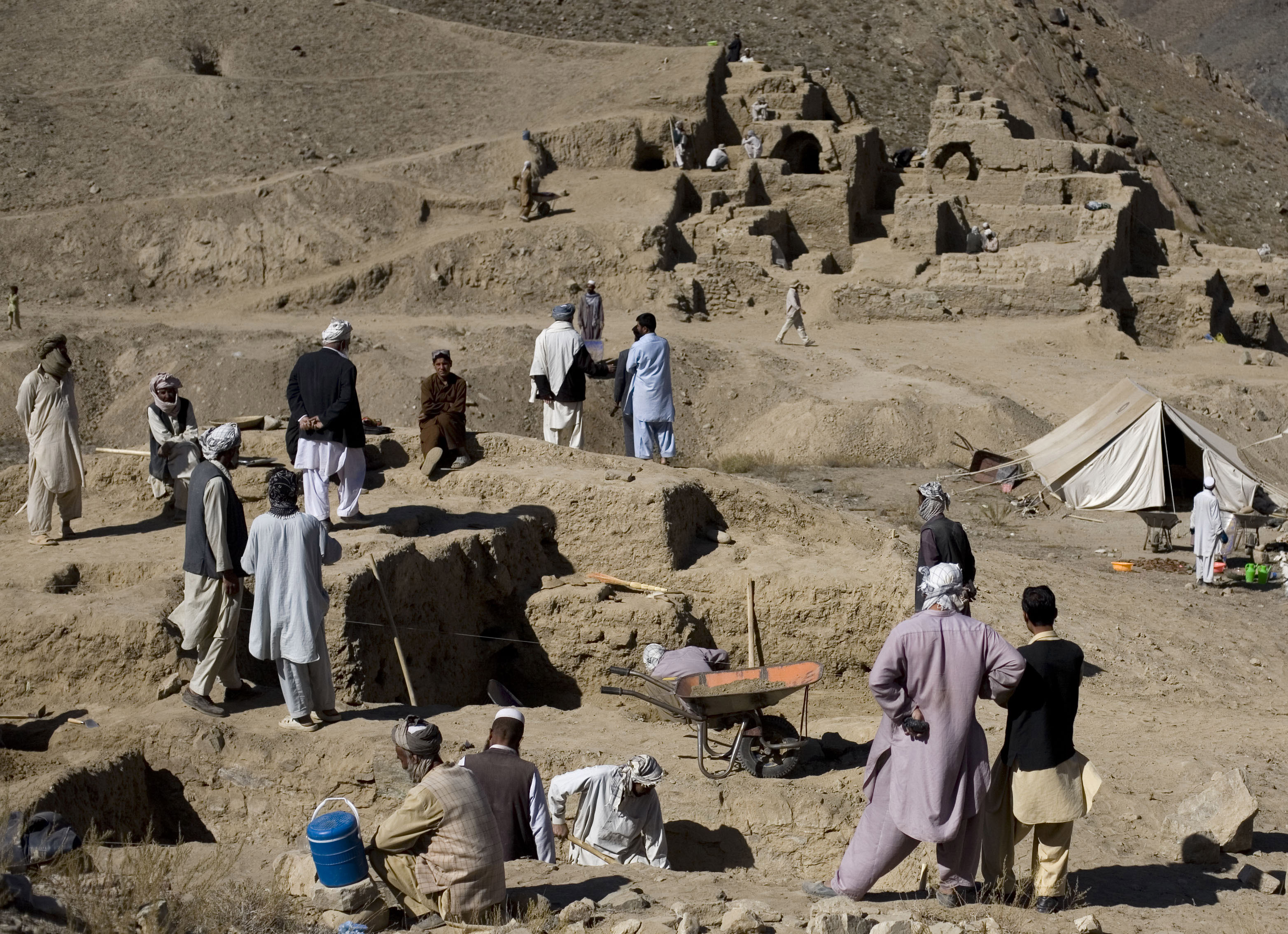 ** ADVANCE FOR USE MONDAY, FEB. 14, 2011 AND THEREAFTER ** In this photograph made on Tuesday, Oct. 12, 2010, men work on the excavation of a sprawling 2,600-year-old Buddhist monastery in Mes Aynak, south of Kabul, Afghanistan. The archaeological dig is located at the world's second-biggest unexploited copper mine. The Chinese government-backed mining company, China Metallurgical Group Corp., which won the contract to exploit the site, has given archaeologists three years to finish the excavations. Afghanistan's vast mineral wealth is no secret. Mining companies, both Afghan and foreign, have already shown interest in some of the country's rich resources, notably copper, iron ore and oil. But with poor infrastructure and a security situation that is precarious at best _ and downright prohibitive in some parts of the country _ there has been a limit to how much the country can hope to make, in the medium term at least. (AP Photo/Dusan Vranic)