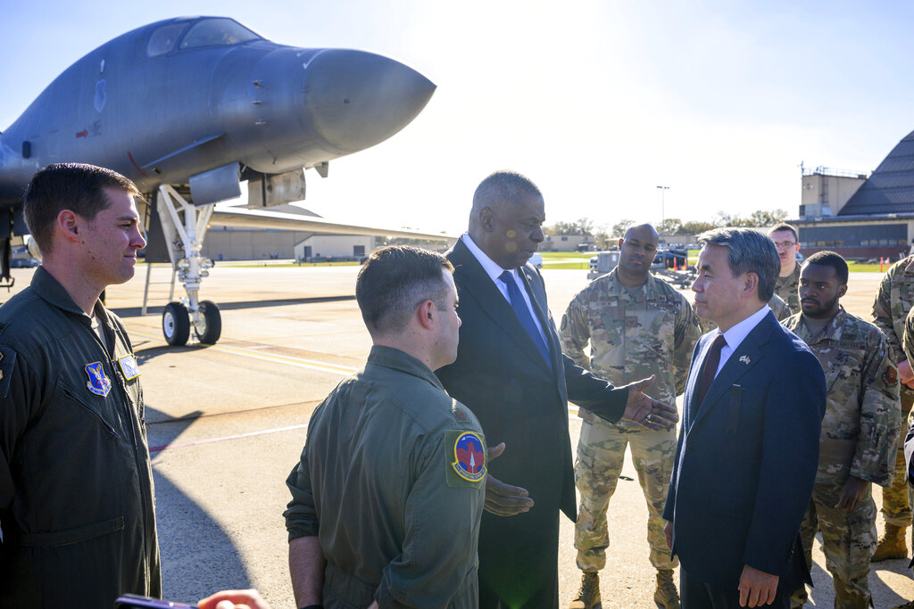 US Secretary of Defence Lloyd Austin and South Korea's Minister of National Defence Lee Jong-sup talk in front of a B-1 bomber during a visit to Andrews Air Force Base on November 3, 2022 [Mandel Ngan/pool/AP]