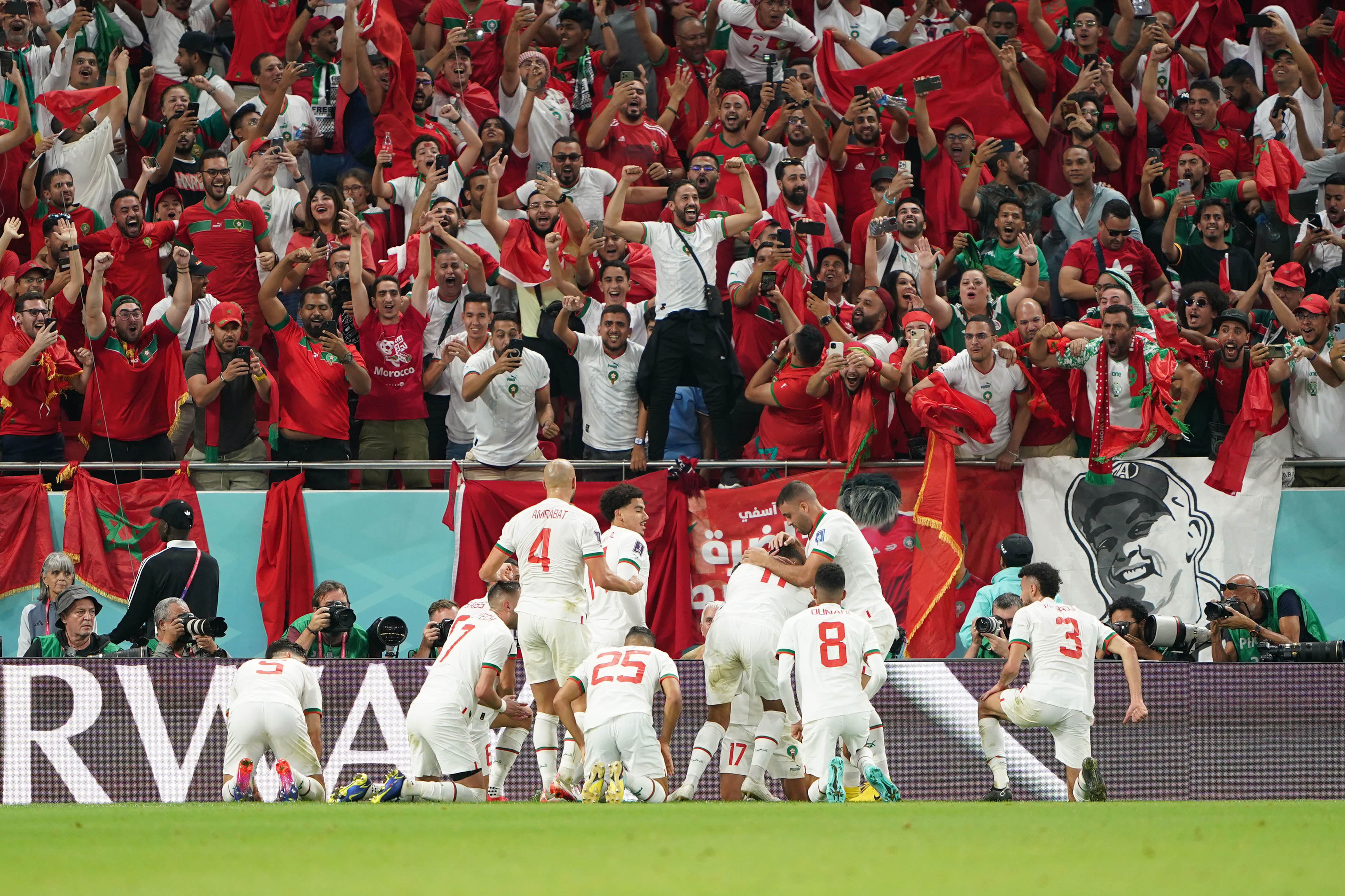 Moroccan team and fans celebrating after scoring their first goal against Belgium in their Group F game on November 27, at Al Thumama Stadium in Doha, Qatar