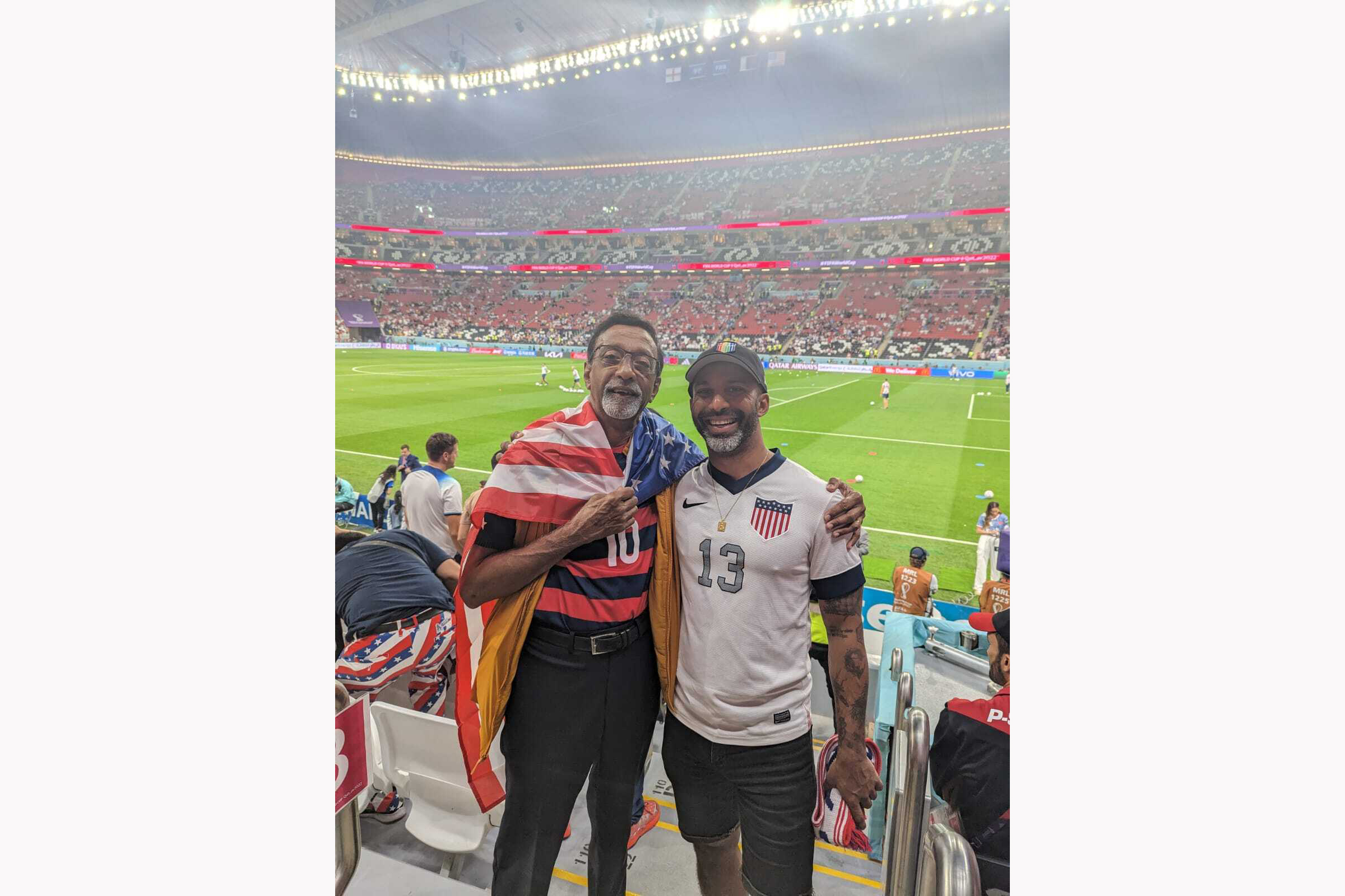 Vignesh Ram with his father at a World Cup match in Qatar.