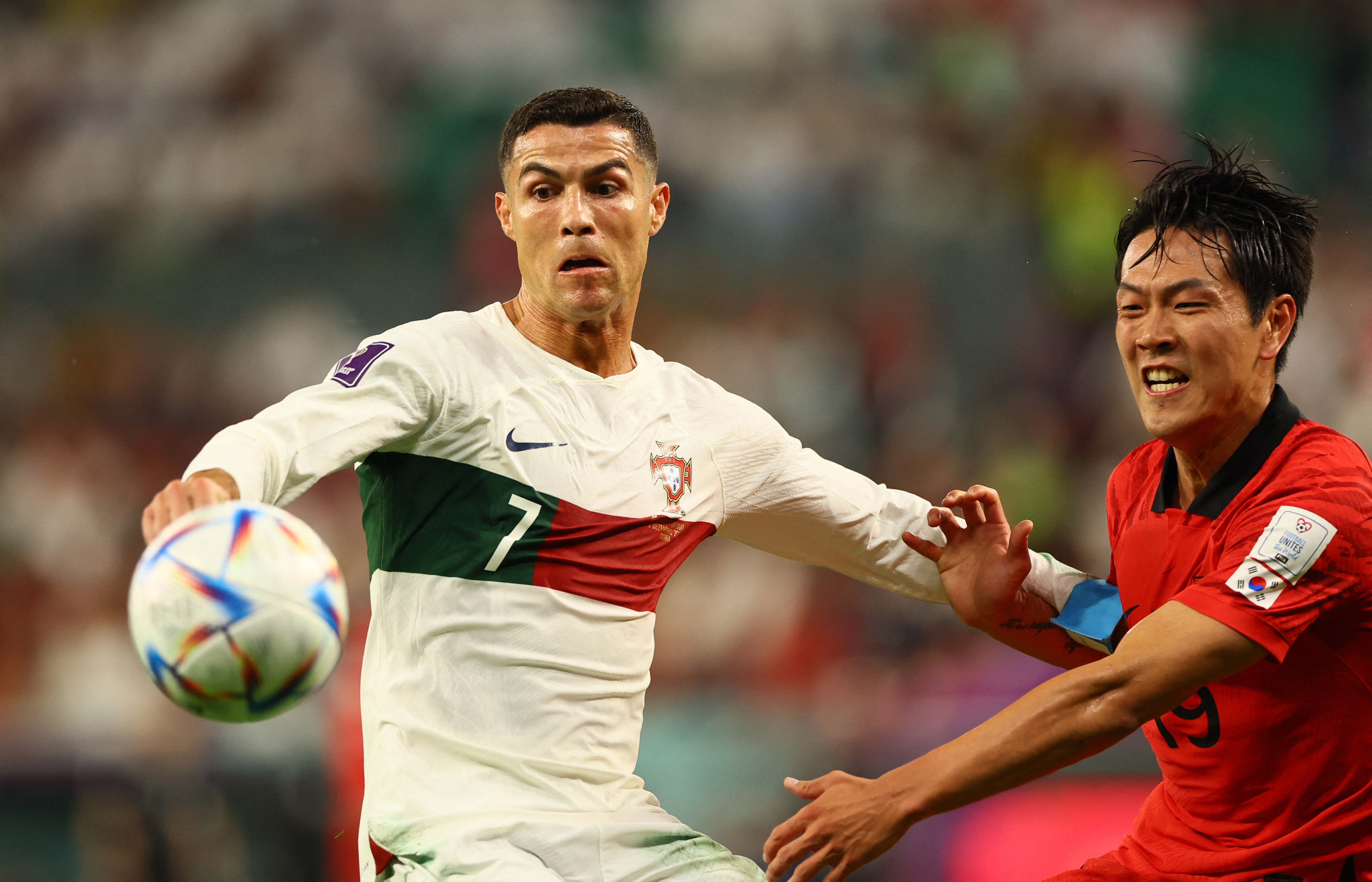 Soccer Football - FIFA World Cup Qatar 2022 - Group H - South Korea v Portugal - Education City Stadium, Al Rayyan, Qatar - December 2, 2022 Portugal's Cristiano Ronaldo in action with South Korea's Kim Young-gwon REUTERS/Wolfgang Rattay