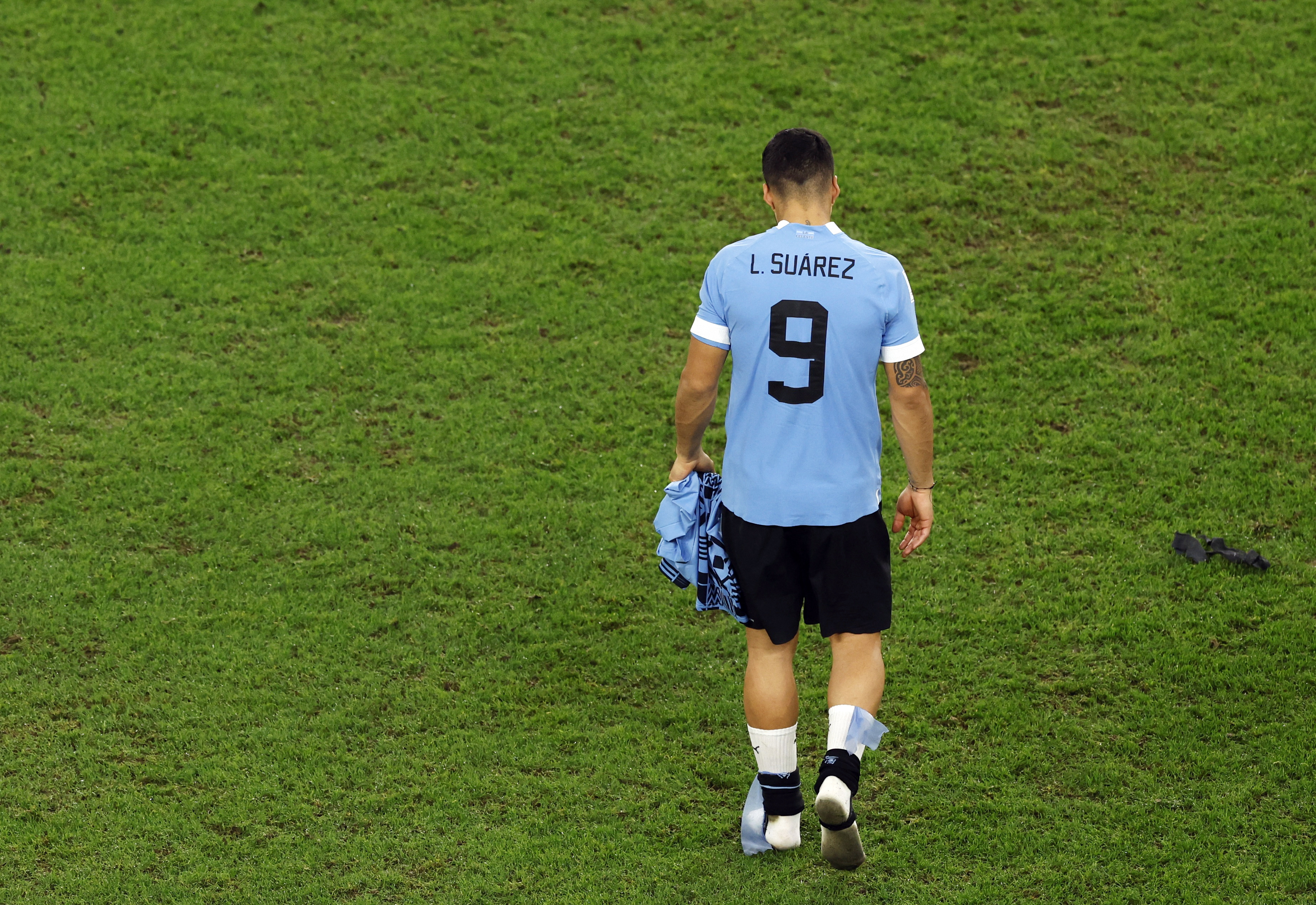 Uruguay’s Luis Suarez looks dejected after the match as Uruguay are eliminated from the World Cup despite beating Ghana in their final group match