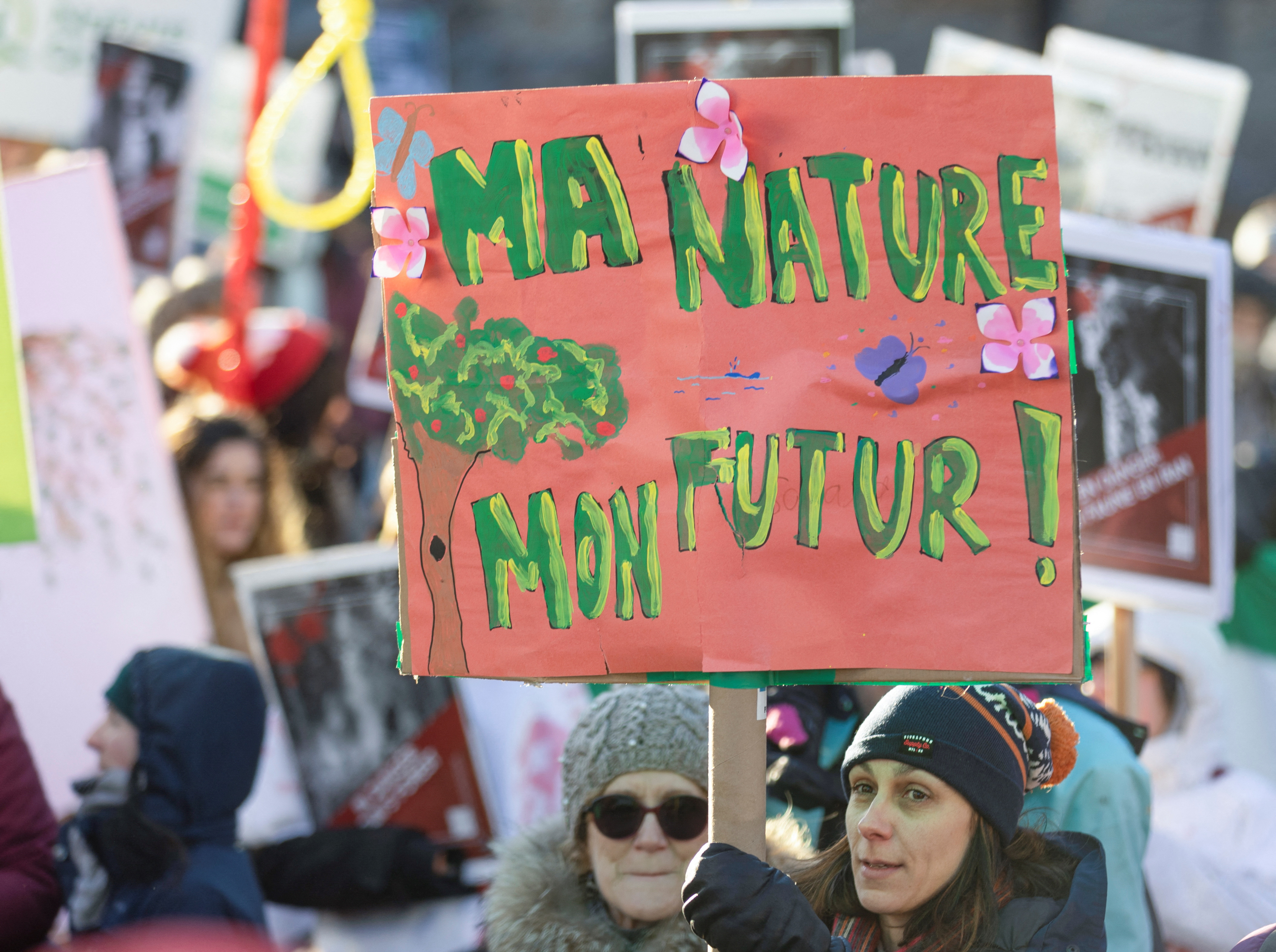 People take part in a march during the opening of COP15, the two-week U.N. Biodiversity summit in Montreal, Quebec, Canada December 10, 2022. REUTERS/Christinne Muschi