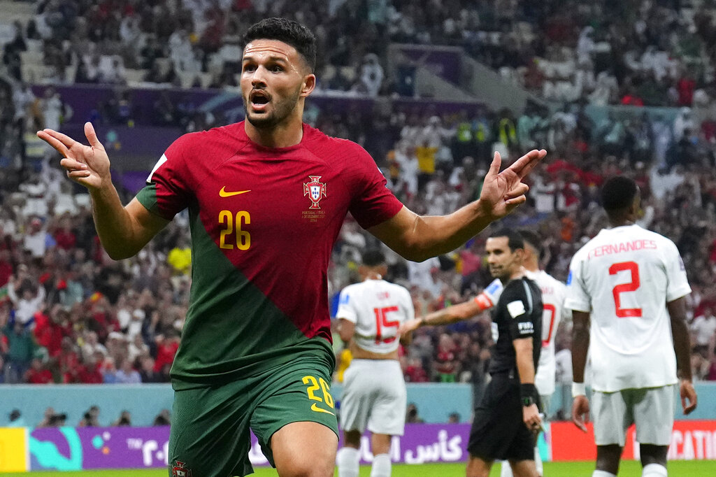 Portugal's Goncalo Ramos celebrates after scoring a goal during the World Cup round of 16 soccer match between Portugal and Switzerland, at the Lusail Stadium in Lusail, Qatar, on December 6, 2022 [Natacha Pisarenko/AP Photo]