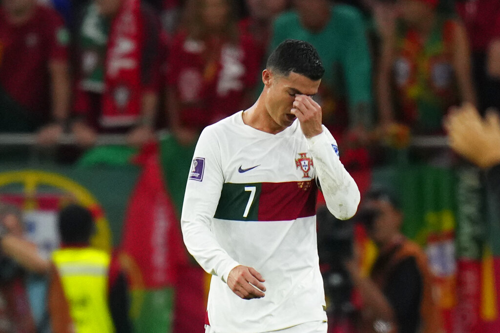 Portugal’s Cristiano Ronaldo, centre, reacts at the end of the World Cup quarterfinal football match between Morocco and Portugal, at Al Thumama Stadium in Doha, Qatar, on December 10, 2022