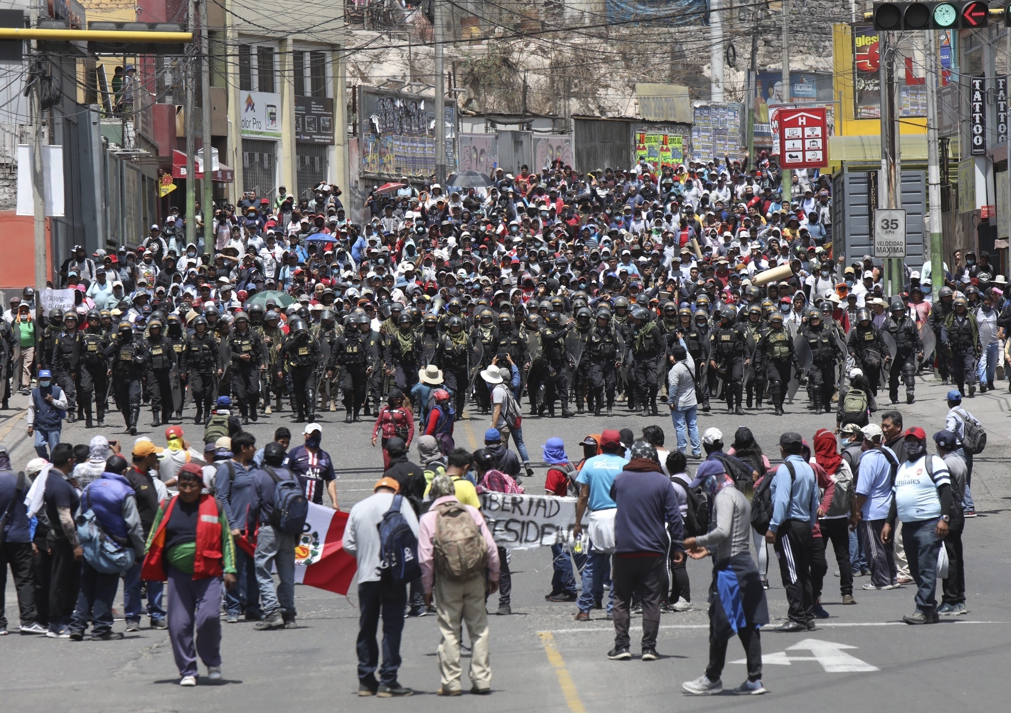 Police arrive where supporters of ousted Peruvian President