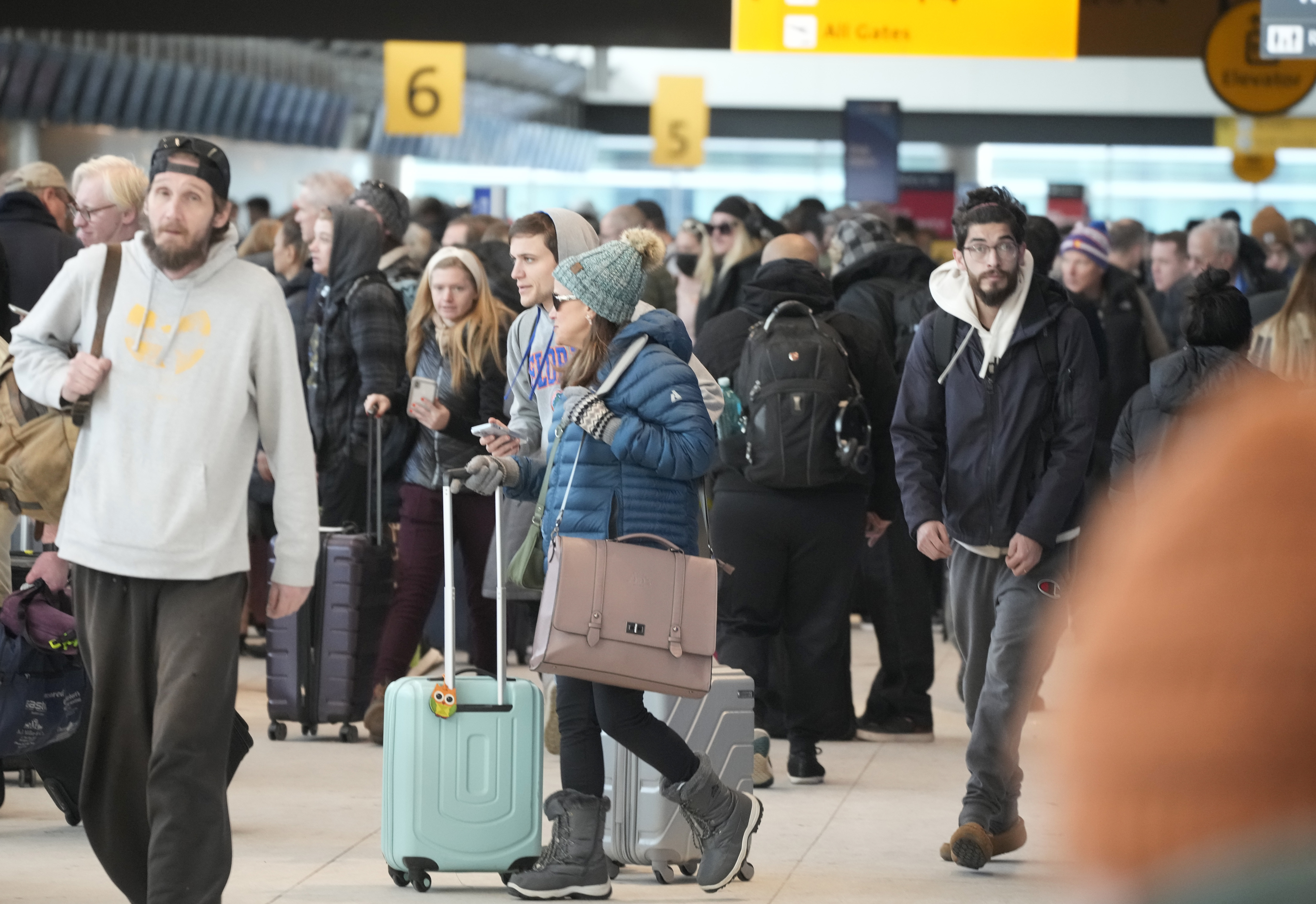 Travelers queue up to check in at the Southwest Airlines counter in Denver International Airport