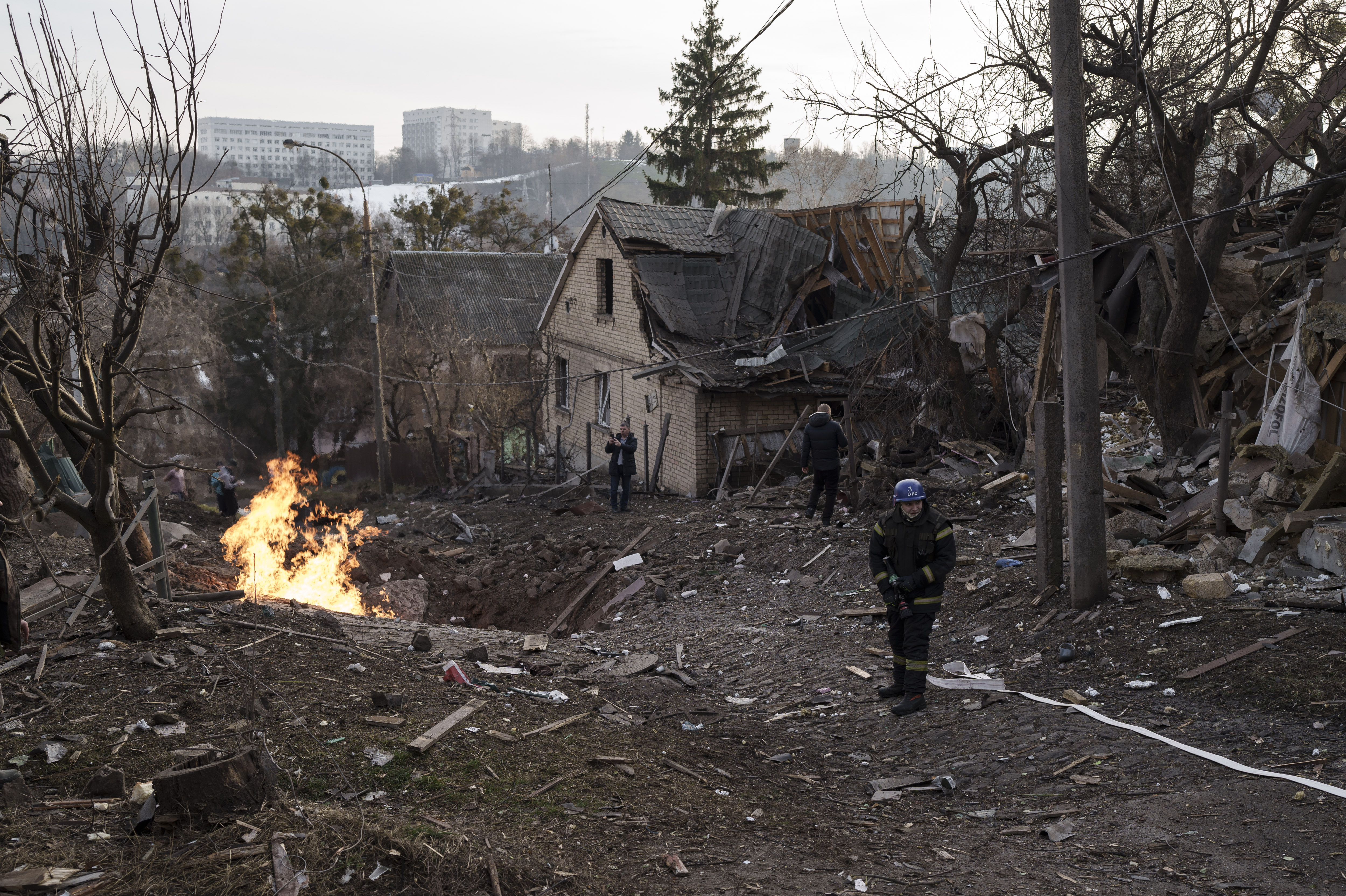 Emergency workers arrive at a residential area hit during a Russian attack in Kyiv,