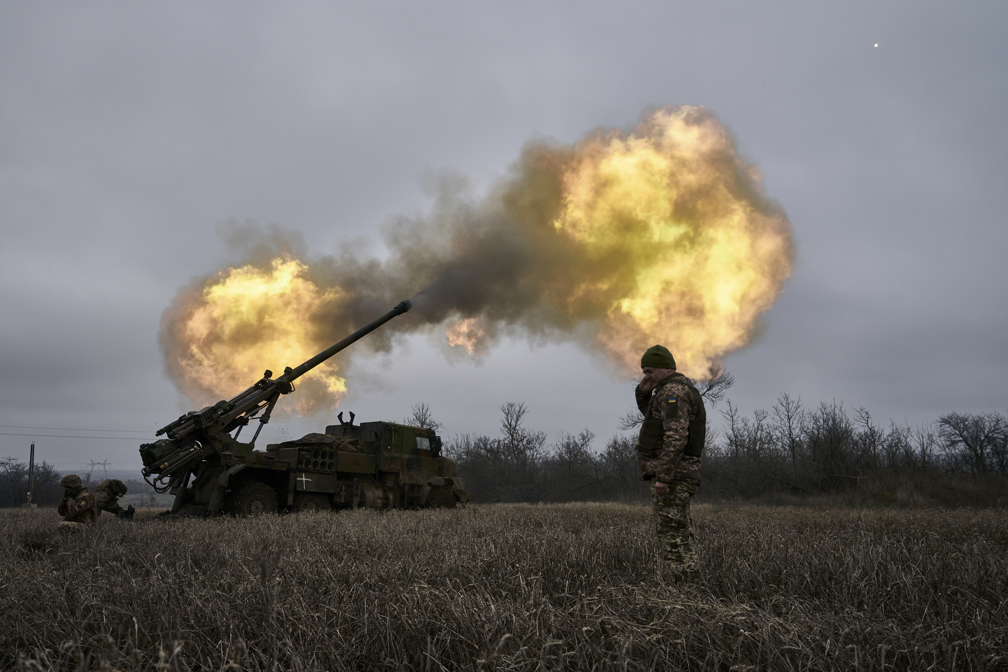 Ukrainian soldiers fire a French-made CAESAR self-propelled howitzer towards Russian positions near Avdiivka, Donetsk region