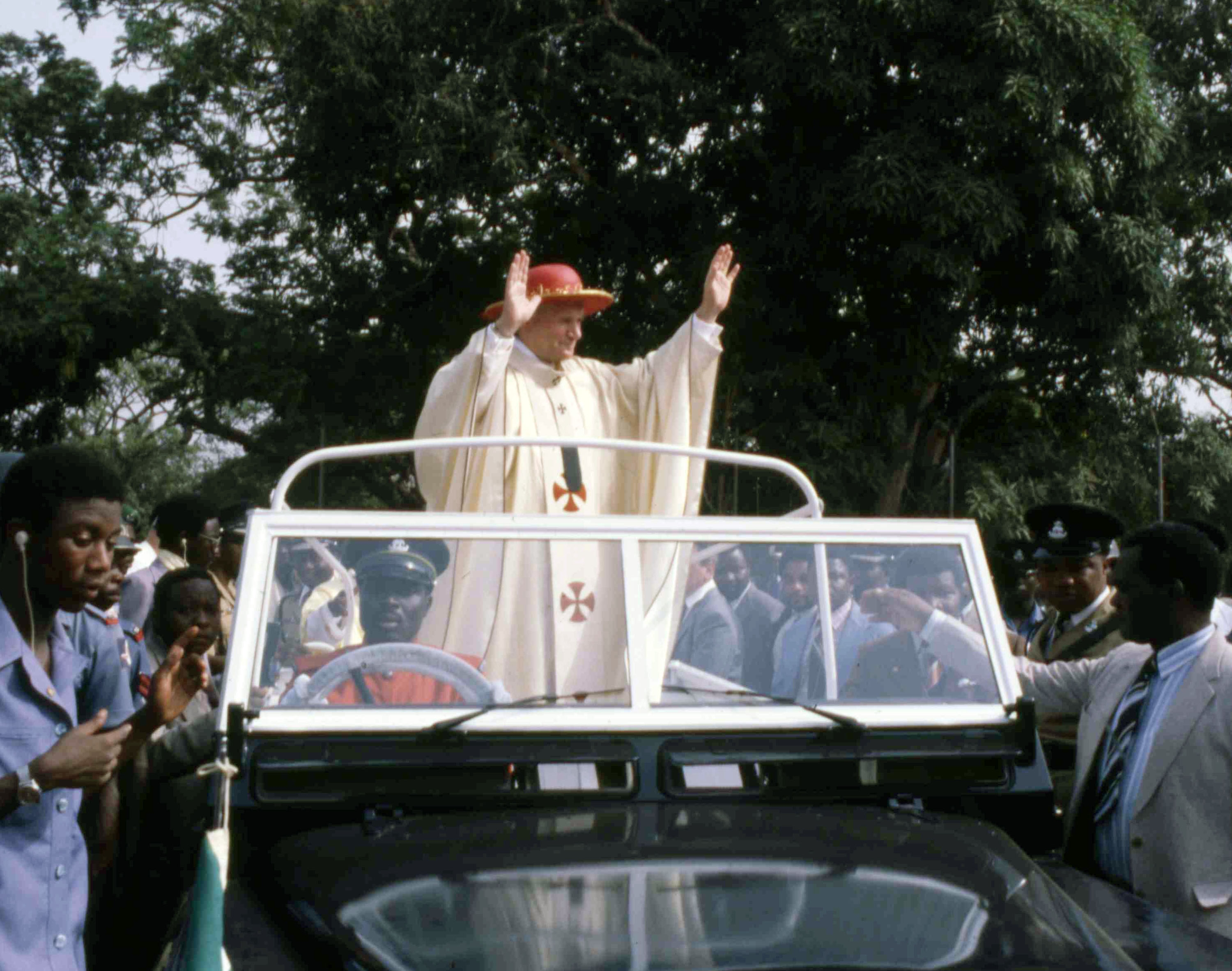 Pope John Paul II waves to the crowds during a visit to Ibadan, Nigeria on Feb. 15, 1982. (AP Photo)