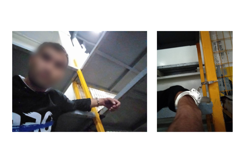 An asylum seeker handcuffed inside the hull of a ferry