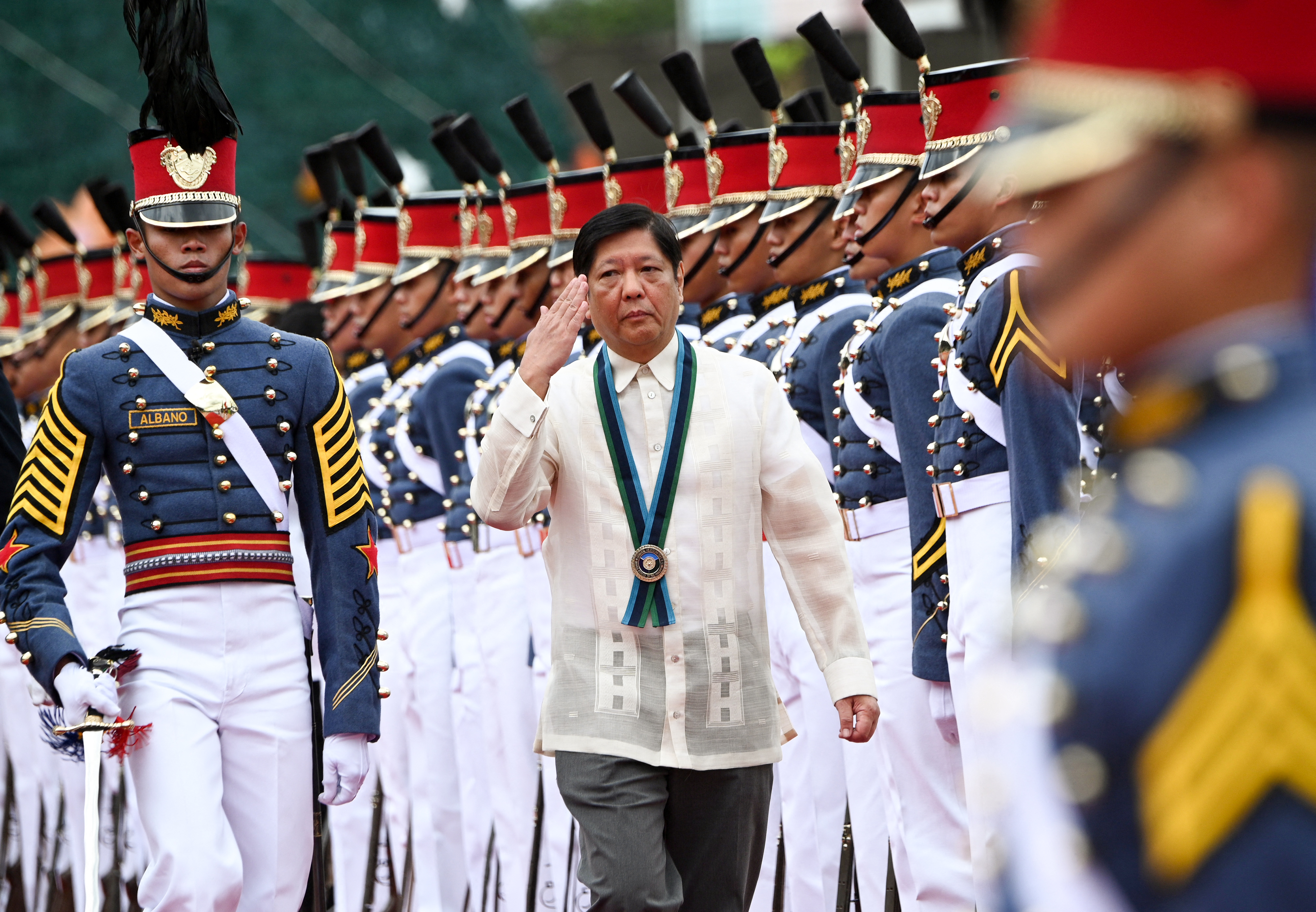 Philippine President Ferdinand Marcos Jr salutes during the 87th anniversary celebration of the Armed Forces of the Philippines in Quezon City, suburban Manila, in December 2022.