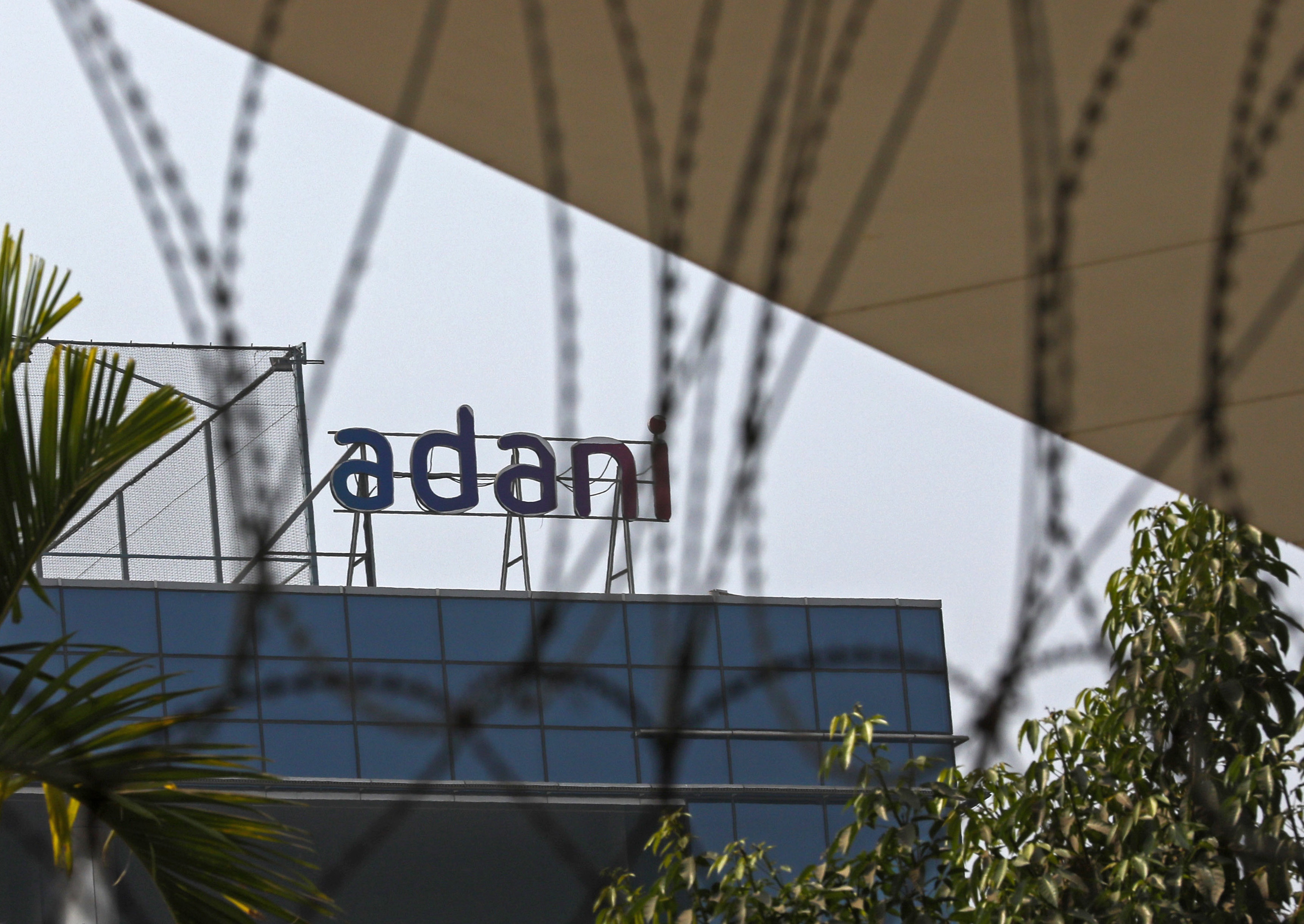 The logo of Adani Group atop a building in Mumbai, India.