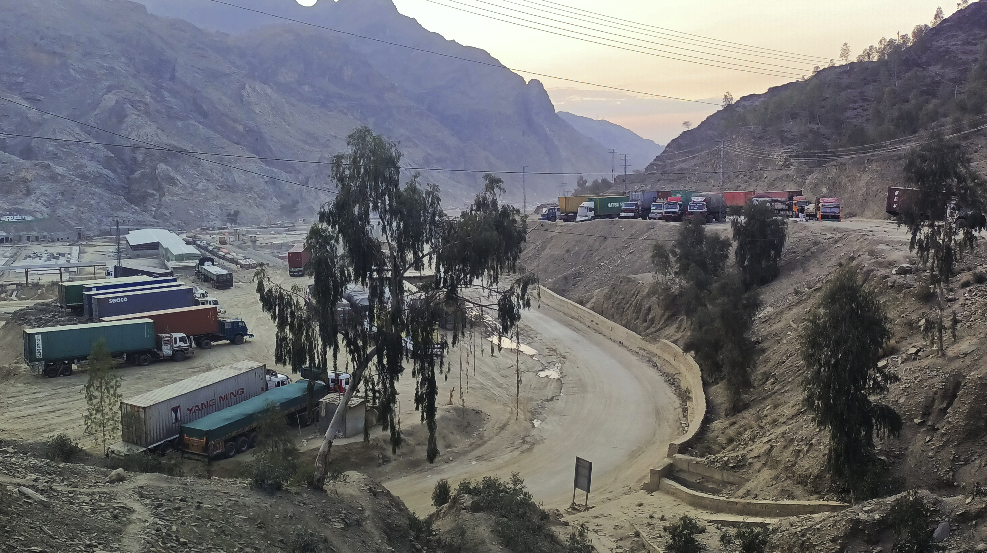 Stranded trucks parked along a highway near Torkham border crossing point in Pakistan