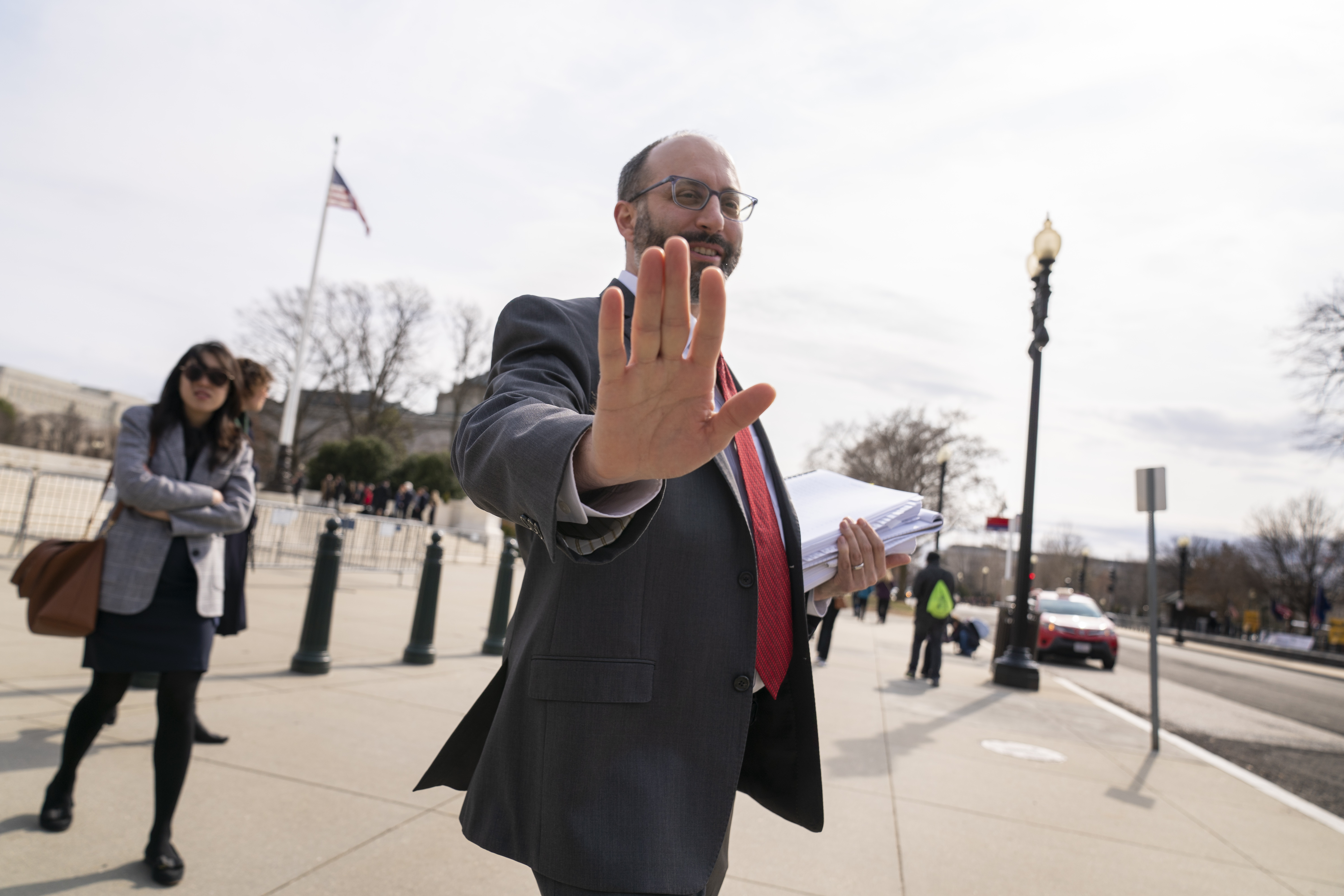 A man stretches a hand out to the camera