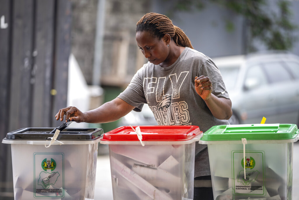 A woman casts her vote at a polling station in Lagos, Nigeria