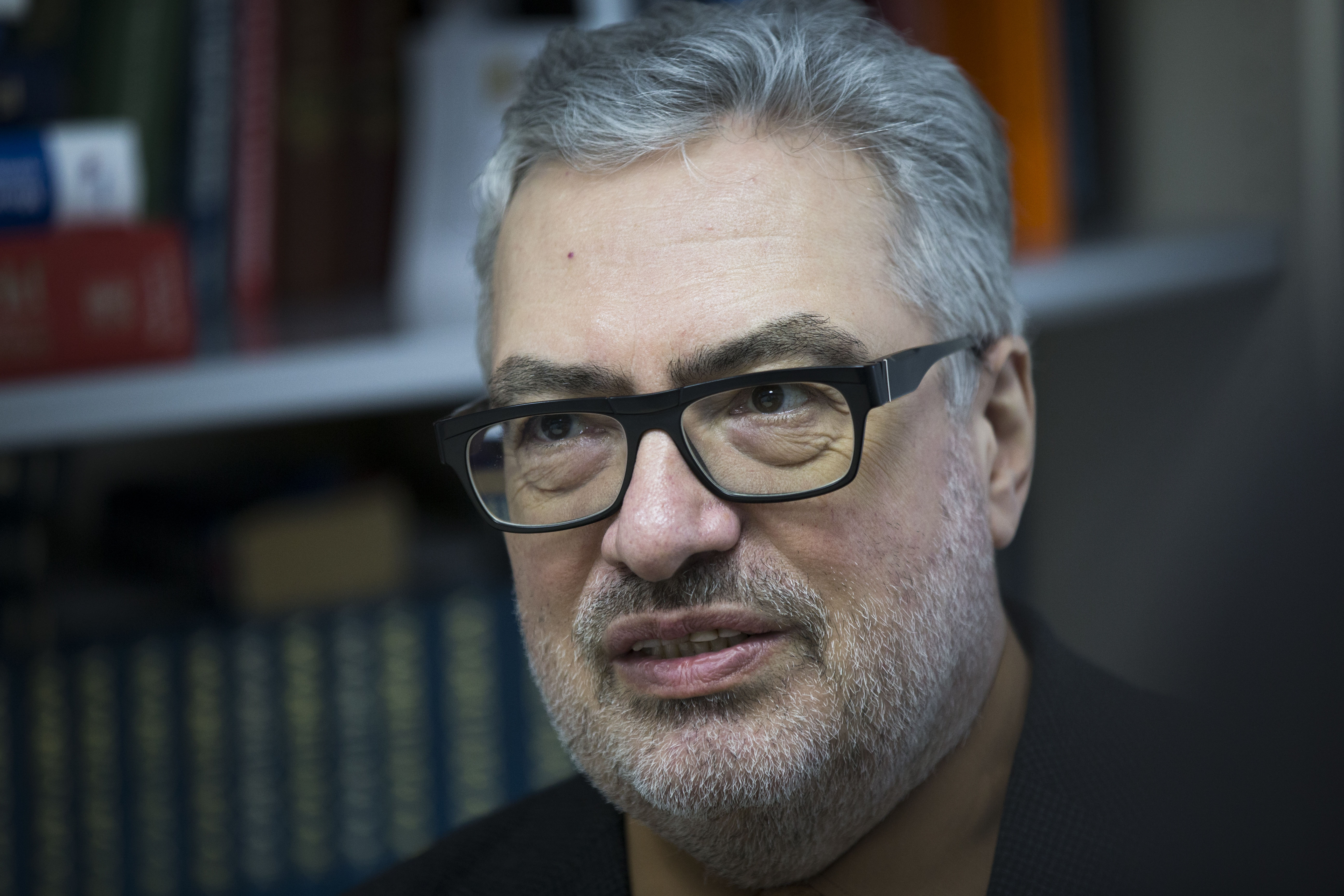 Independent military analyst Pavel Felgenhauer speaks to The Associated Press in Moscow, Russia, Monday, April 6, 2015. Felgenhaeur says Russia is not interested in an all-out war in eastern Ukraine but wants to keep up the tensions by training the rebel forces and making sure theyre combat-ready. (AP Photo/Alexander Zemlianichenko)