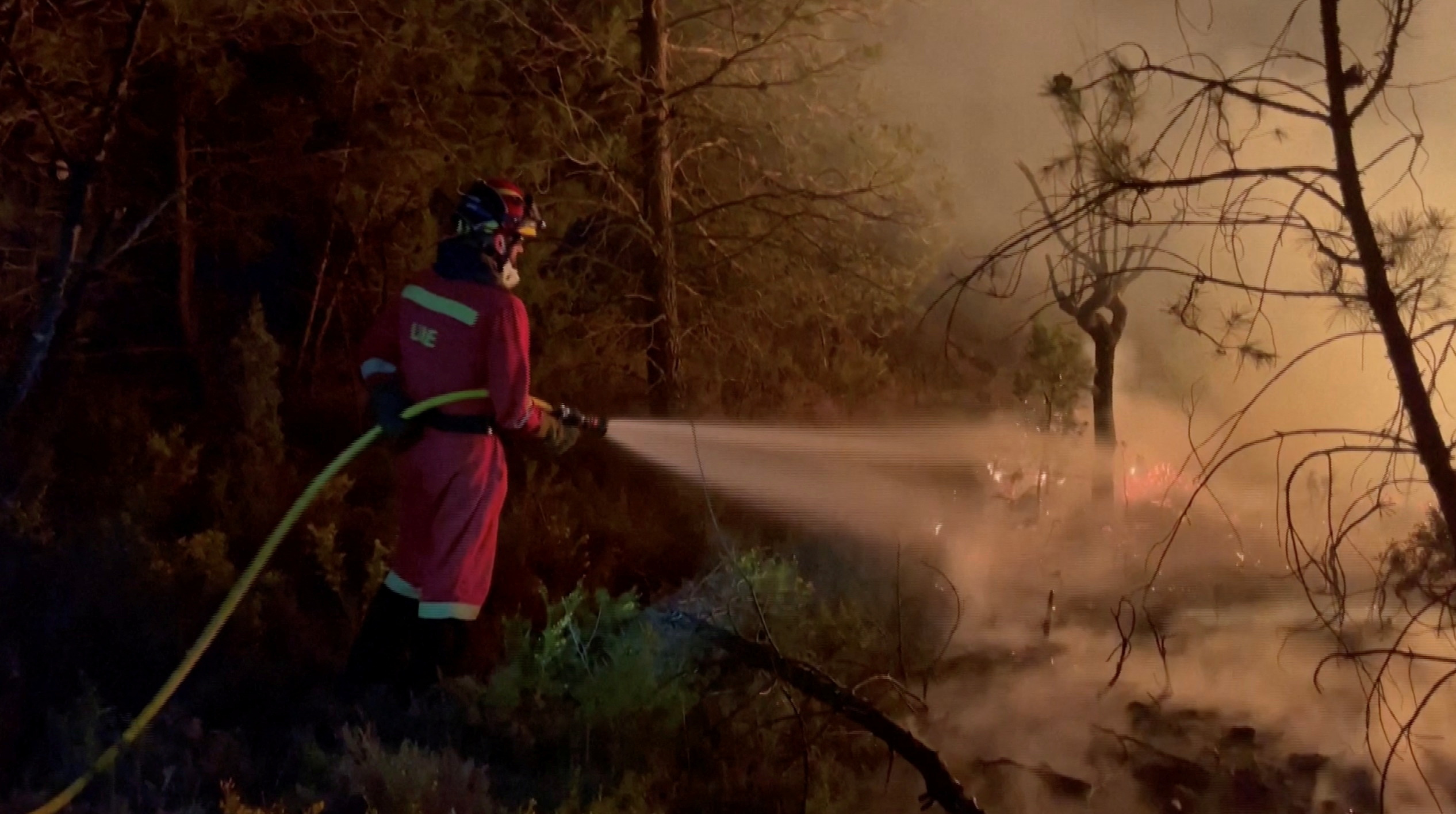 A Military Emergency Unit (UME) firefighter works to battle flames from the Villanueva de Viver wildfire, Spain, March 23, 2023. Military Emergency Unit/Handout via REUTERS THIS IMAGE HAS BEEN SUPPLIED BY A THIRD PARTY. NO RESALES. NO ARCHIVES