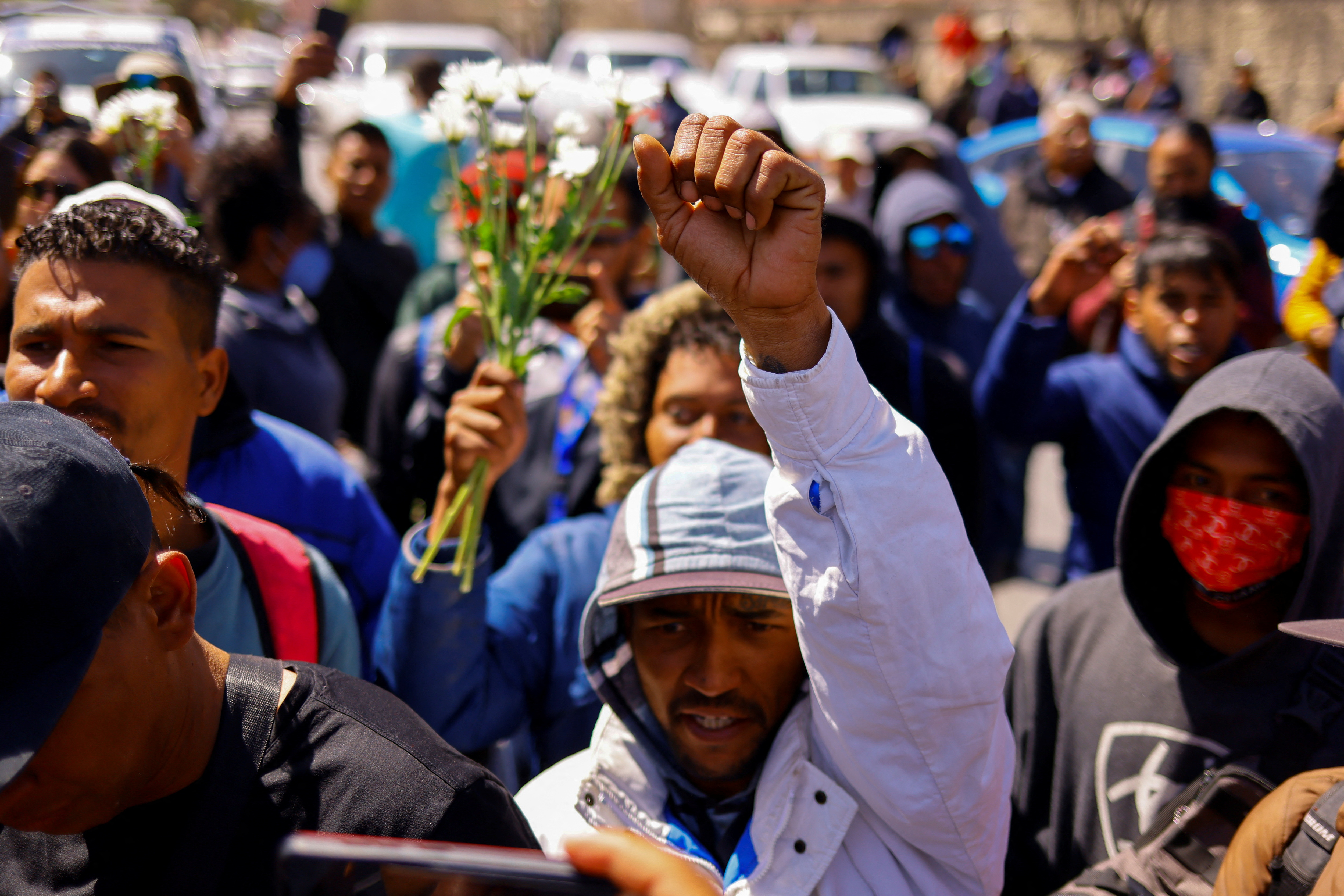 People protest outside the National Institute of Migration building