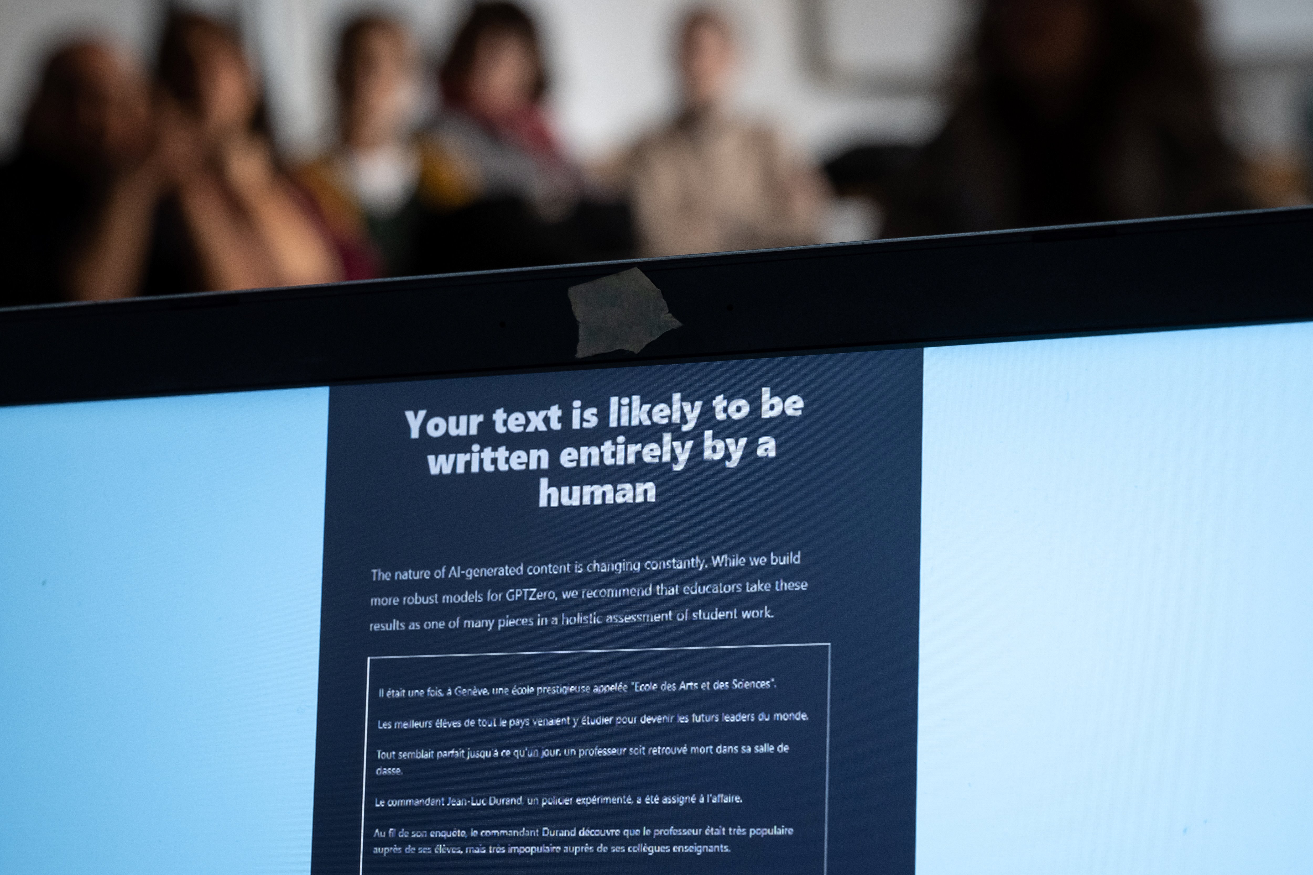 Teachers are seen behind a laptop during a workshop on ChatGpt bot organised for by the School Media Service of the Public education of the Swiss canton of Geneva, on February 1, 2023. 