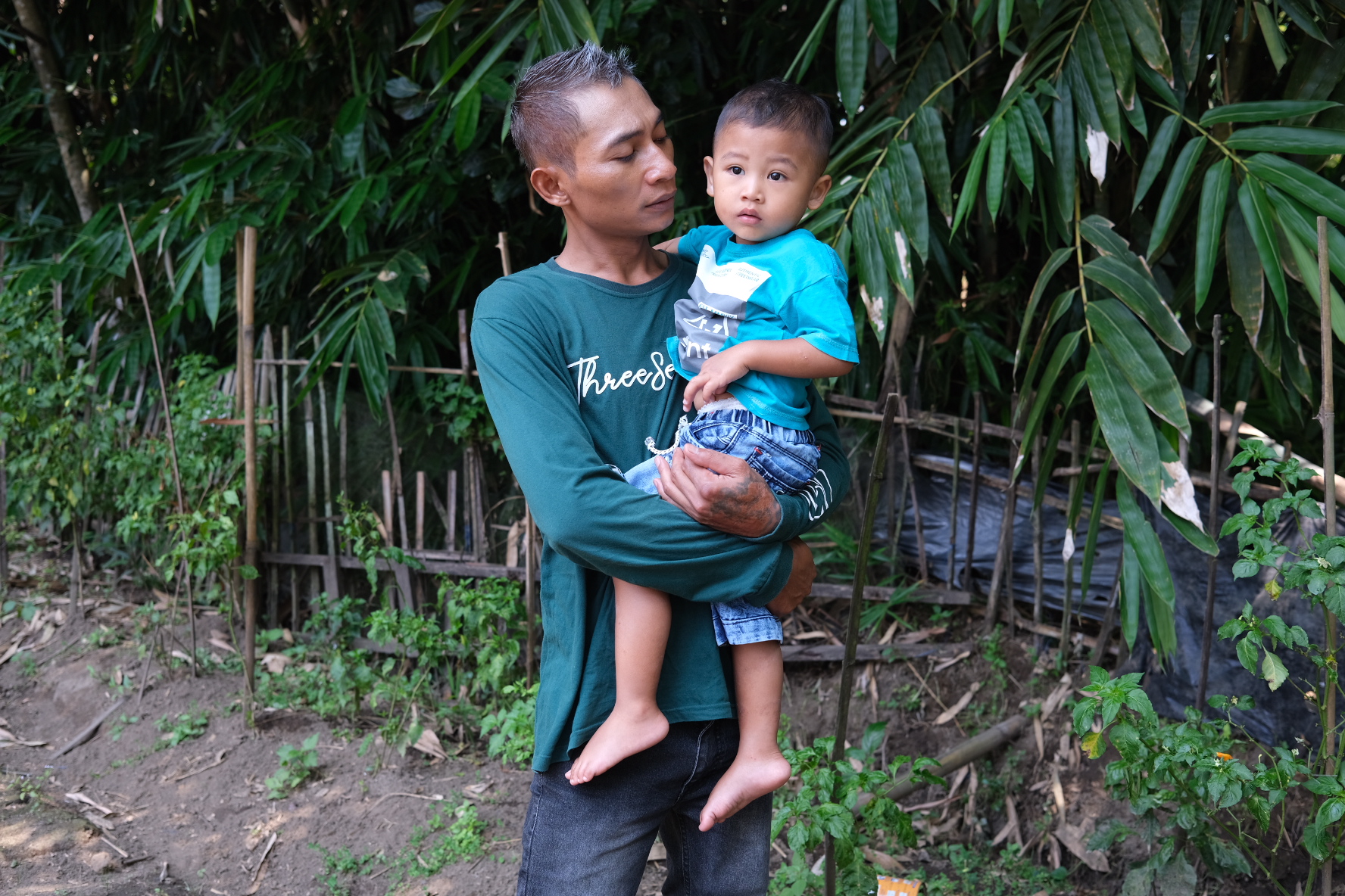 Andik is now a single parent to Rian, who is two years and three months old. He has started raising fish in their back yard to sell, so he can work from home and care for Rian