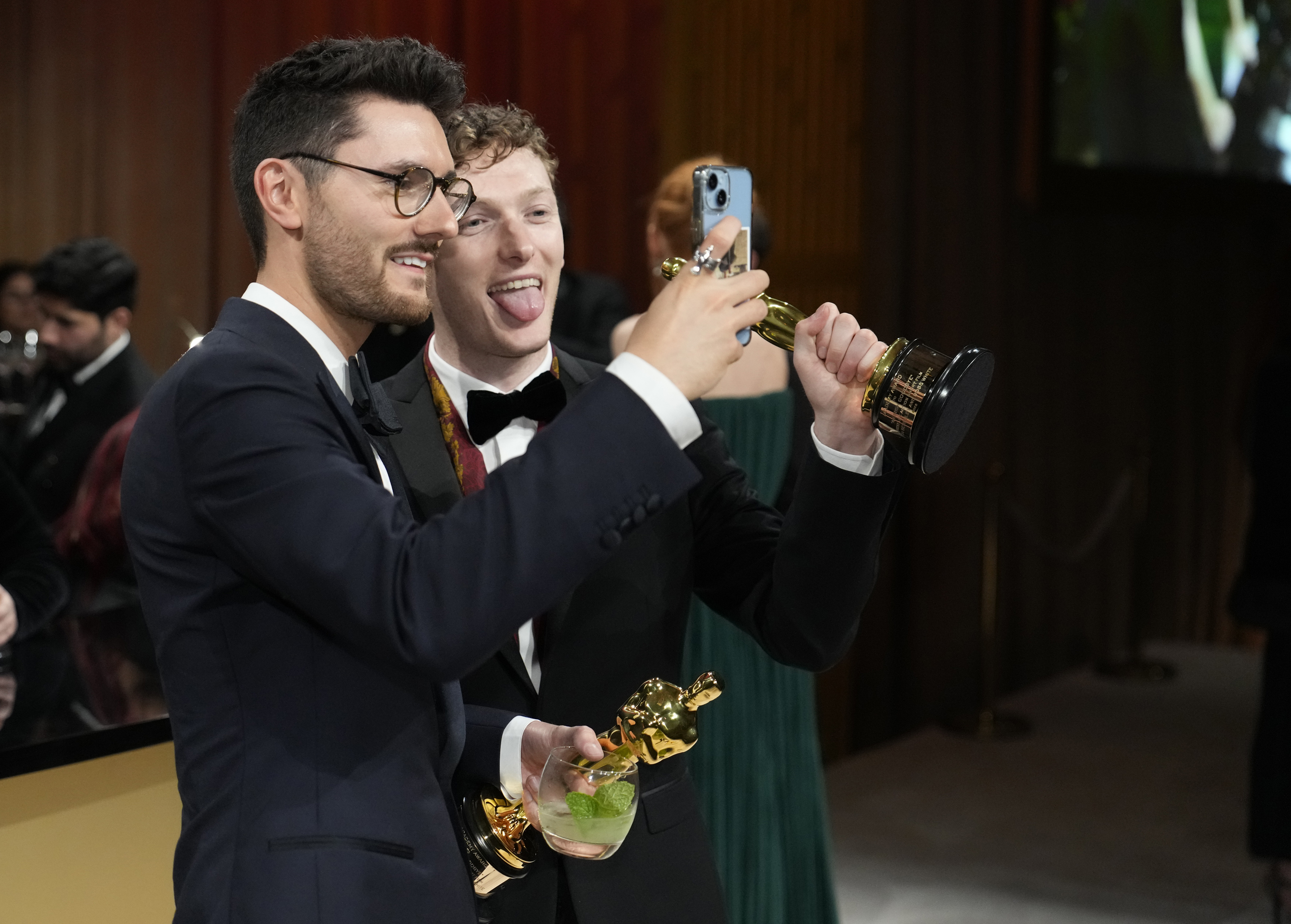 Two men pose for a selfie