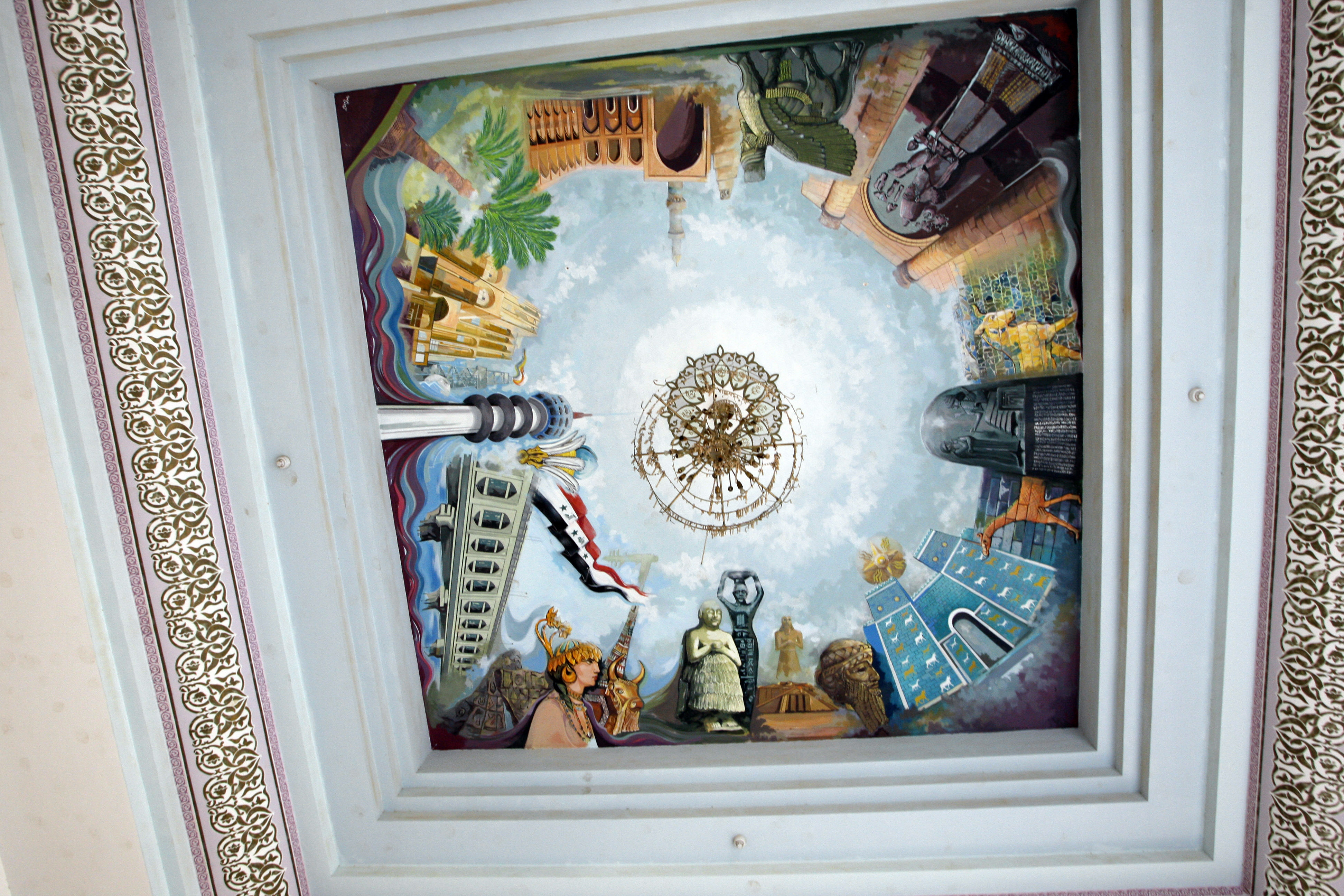 The decorated ceiling of a room in the palace merges the ancient with the modern to depict Iraqi glory