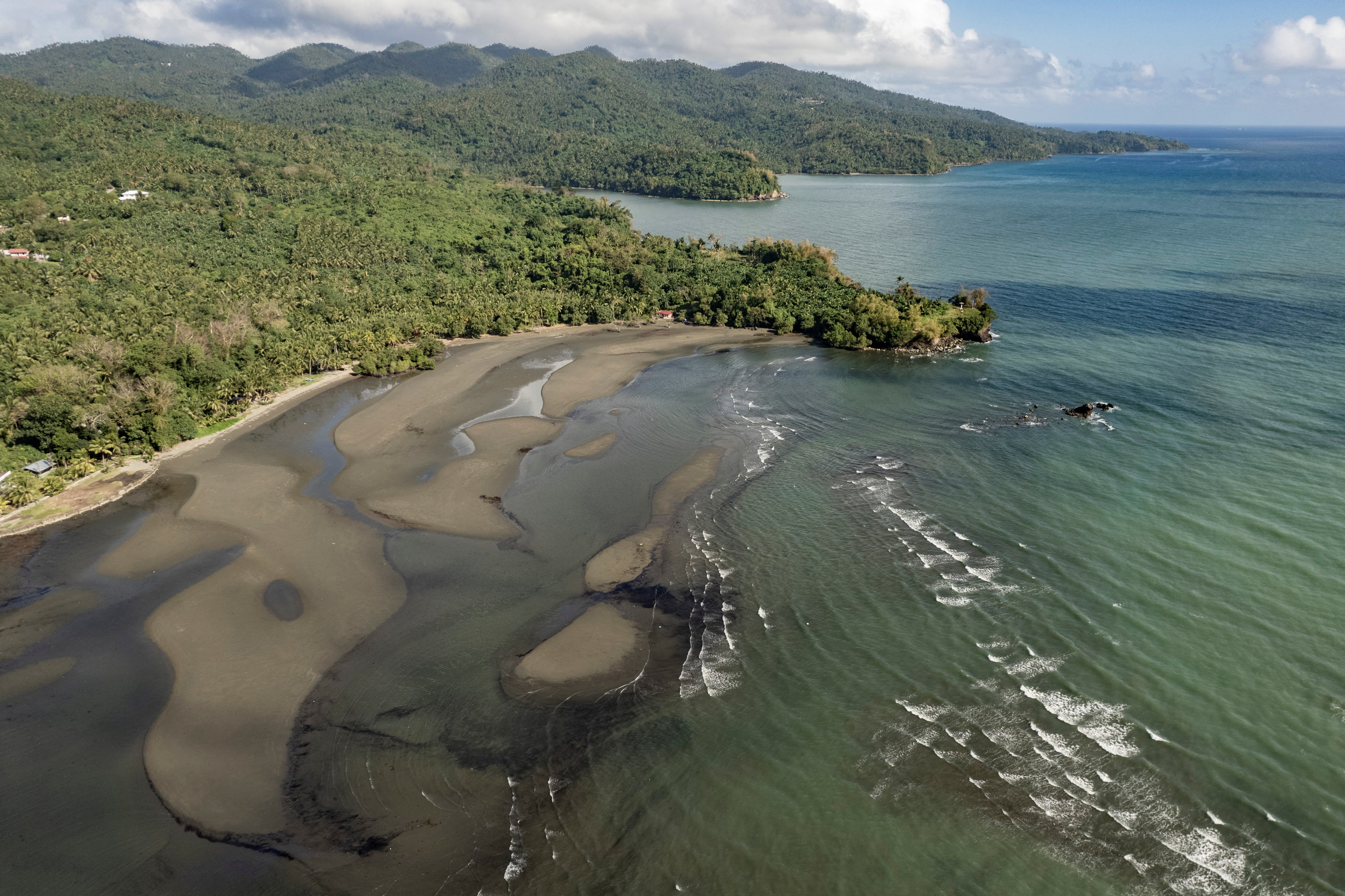 An aerial view shows the oil spill from the tanker MT Princess Empress on the shores of Pola in Oriental Mindoro