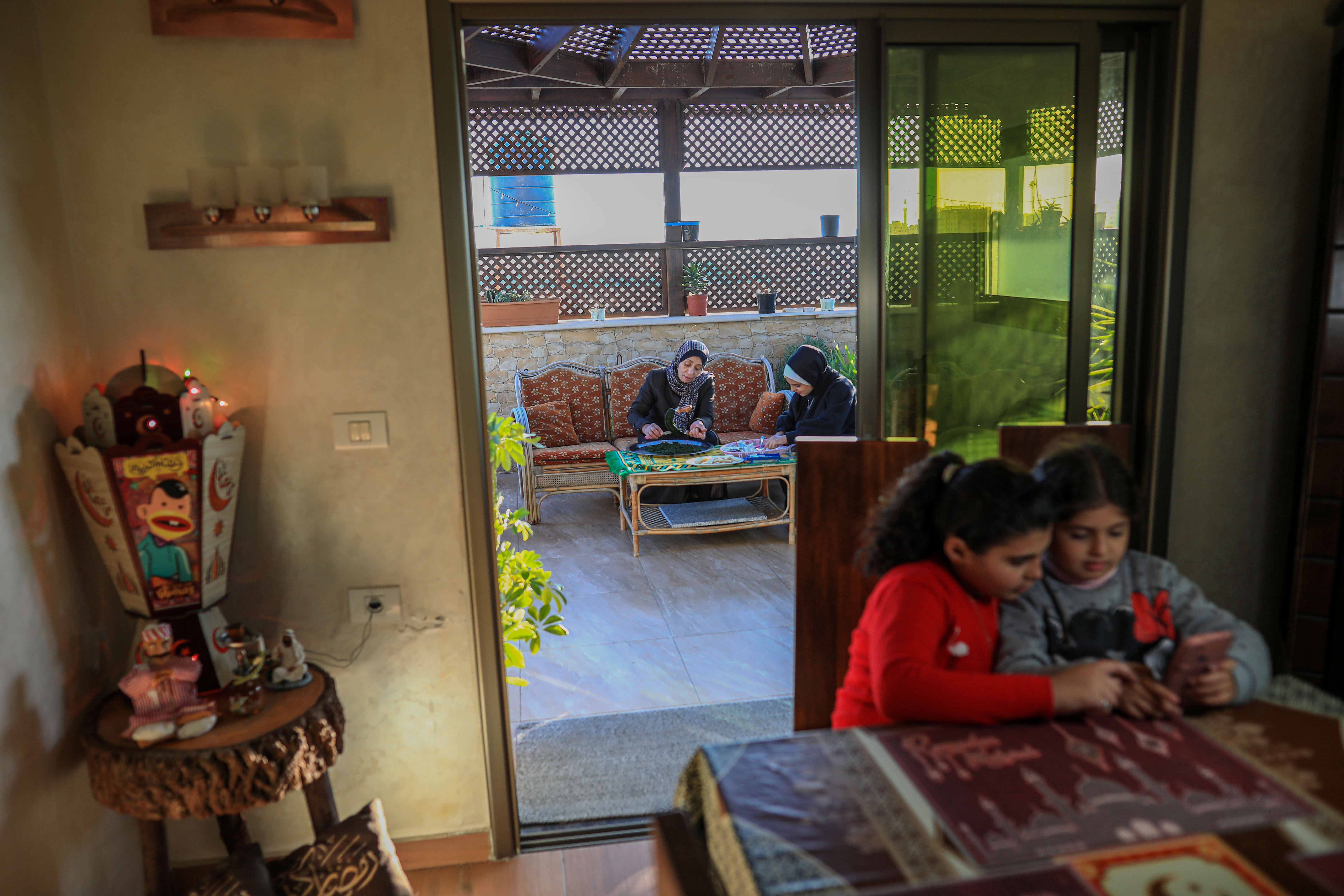 The family gathers on the terrace to break iftar