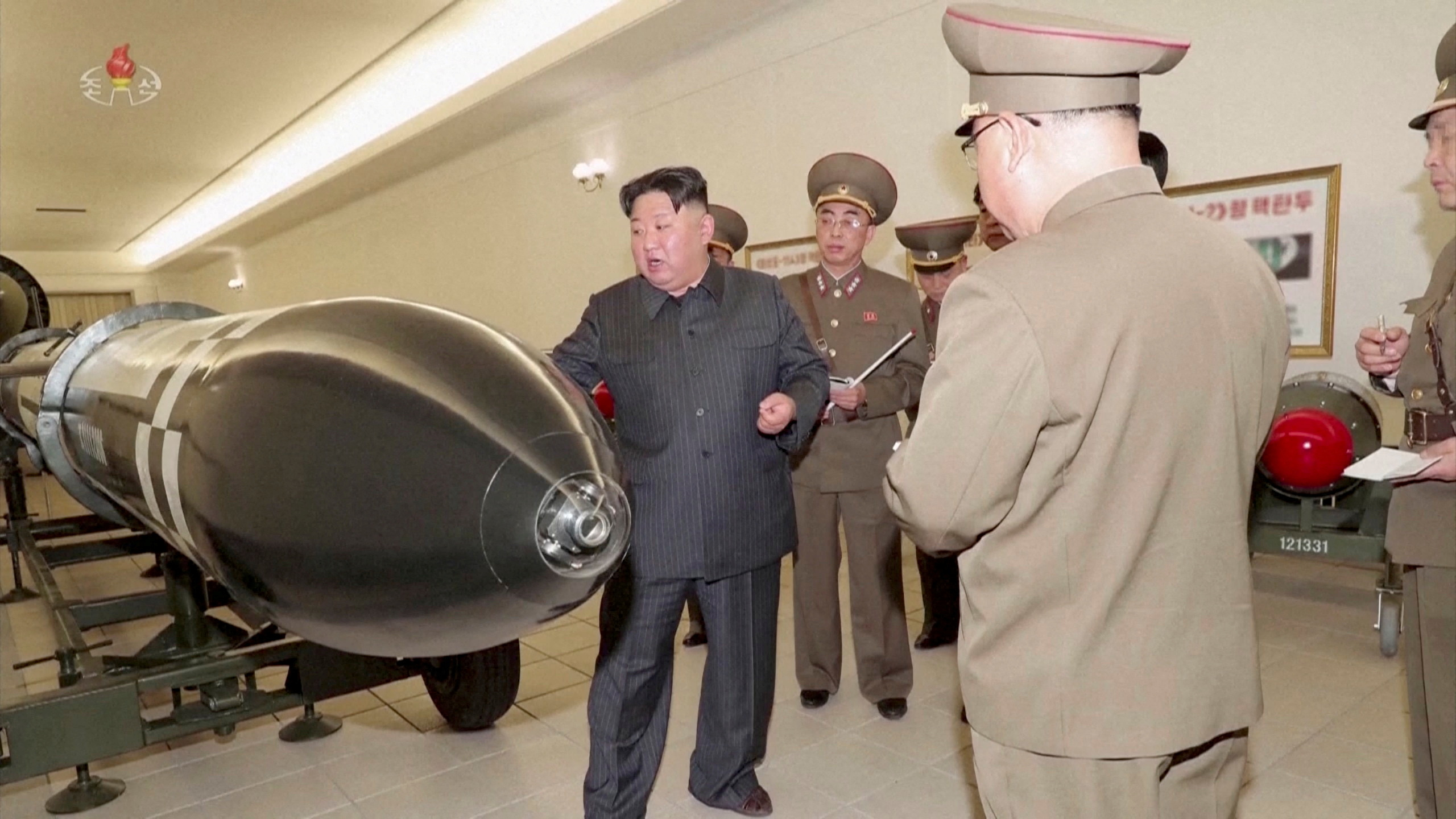 Kim Jong Un inspecting nuclear warheads at an undisclosed location
