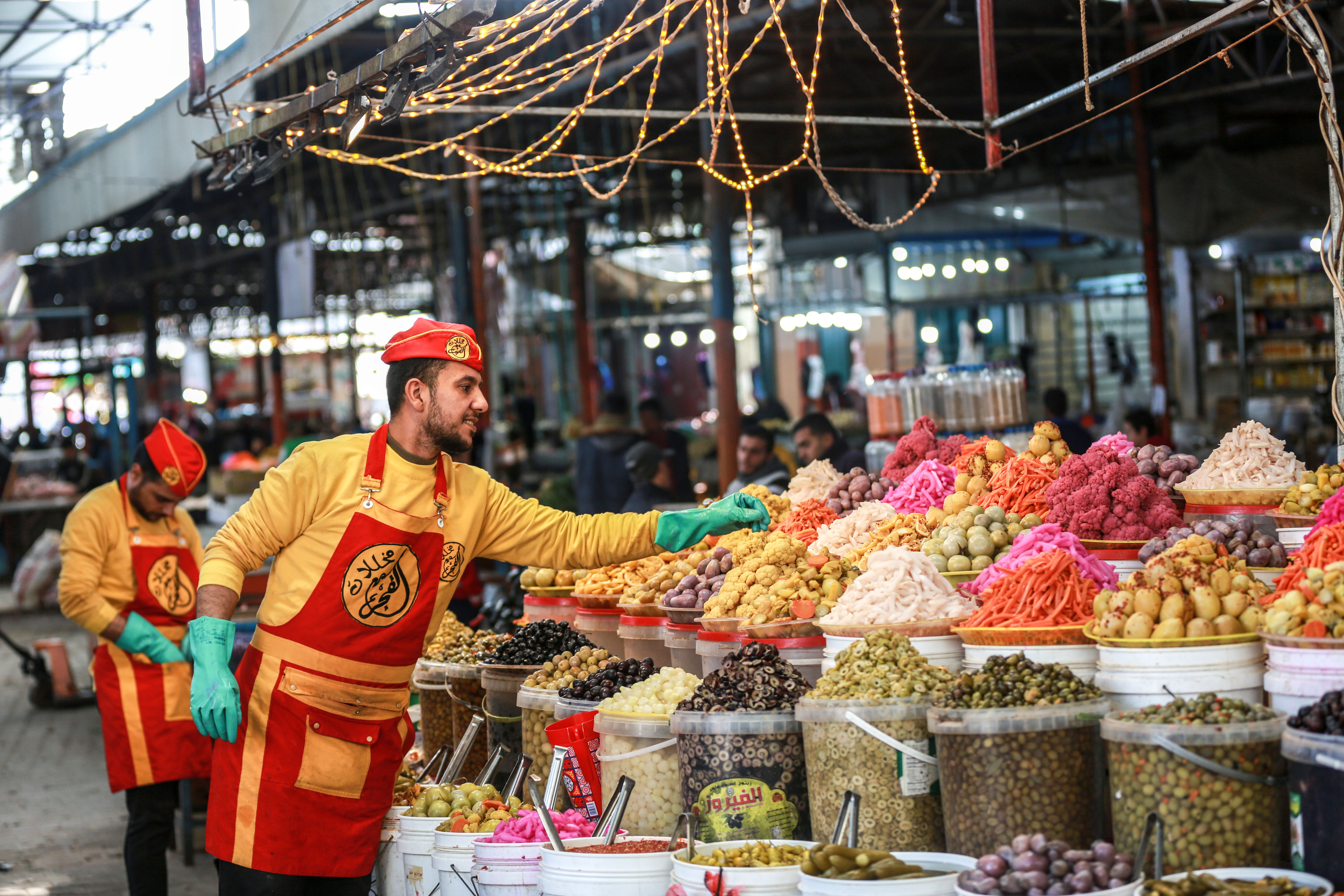 Nader Al-Aidi, 33, a resident of Rafah, south of Gaza, supports three children. He s sells pickles with his younger brother. He inherited this job from his father and its his only source of livelihood for his family. During the month of Ramadan, there is a strong demand for pickles for the rest of the days throughout the year. [Abdelhakim Abu Riash/Al Jazeera]