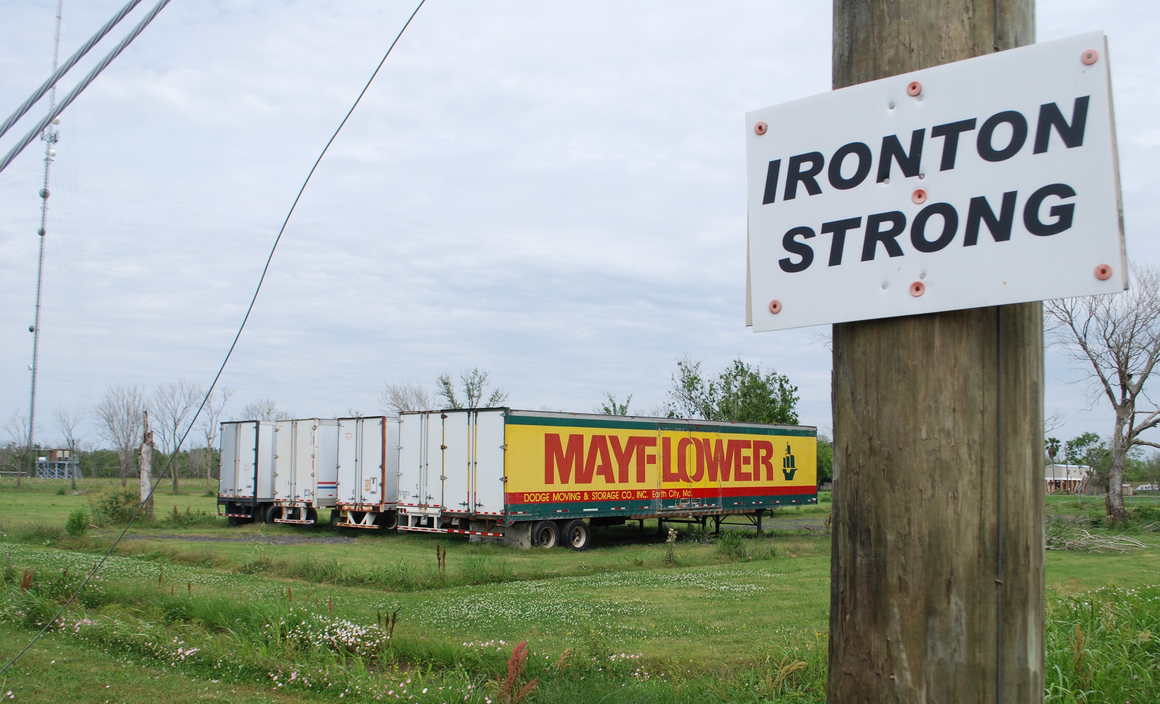 Eighteen months after Ida, tractor-trailers sat beside the only road in and out of Ironton, holding recovered remains from the town cemetery, which was destroyed by the storm. The trailers’ prominent placement is taking a toll on the community’s mental health, according to leader Audrey Trufant Salvant